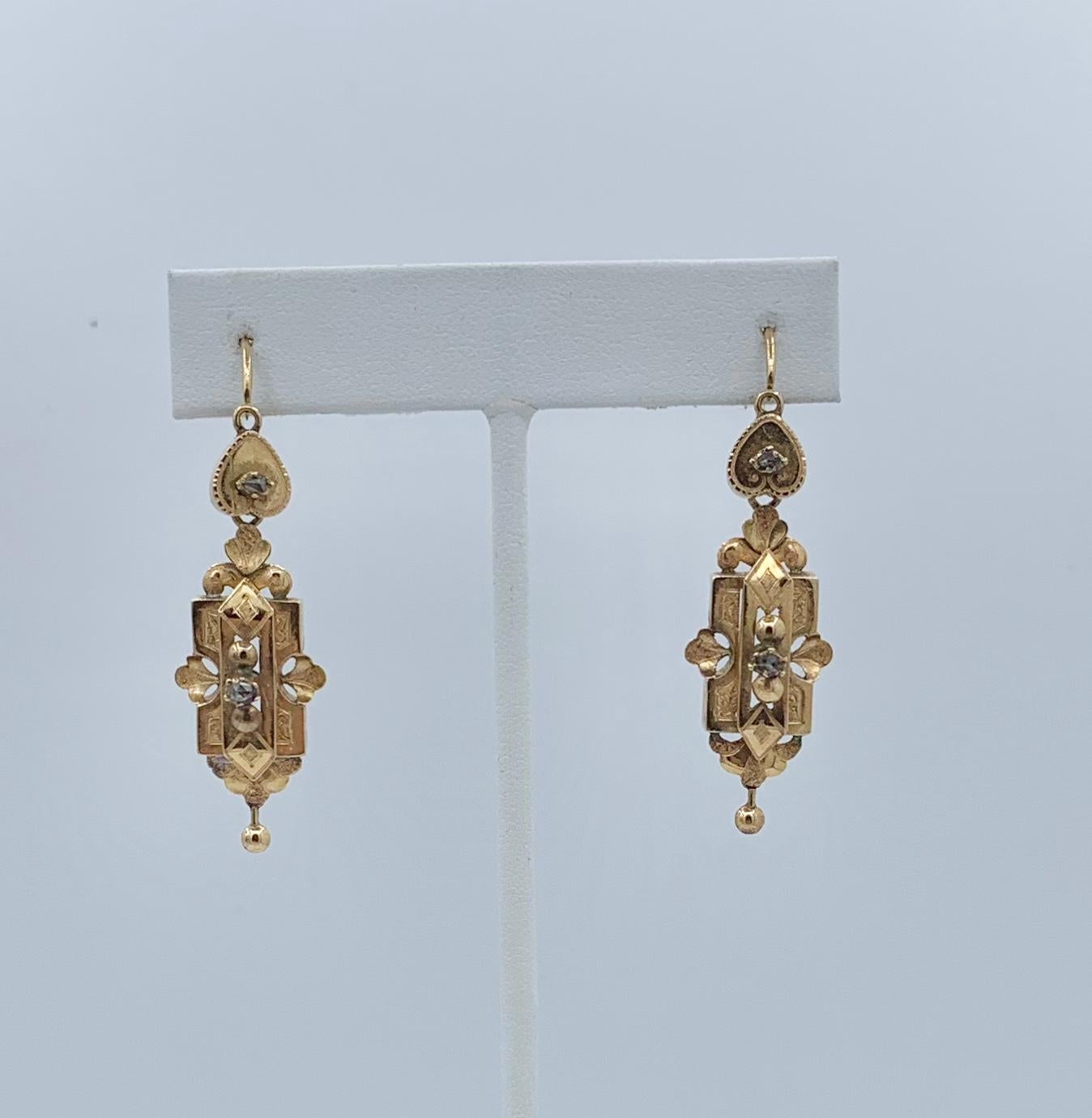 This is very rare pair of early Rose Cut Diamond Antique Georgian - Victorian Dangle Drop Day Night Earrings in 14 Karat Gold with a heart motif.   These antique earrings are of the highest quality.  They have extraordinary design with wonderful