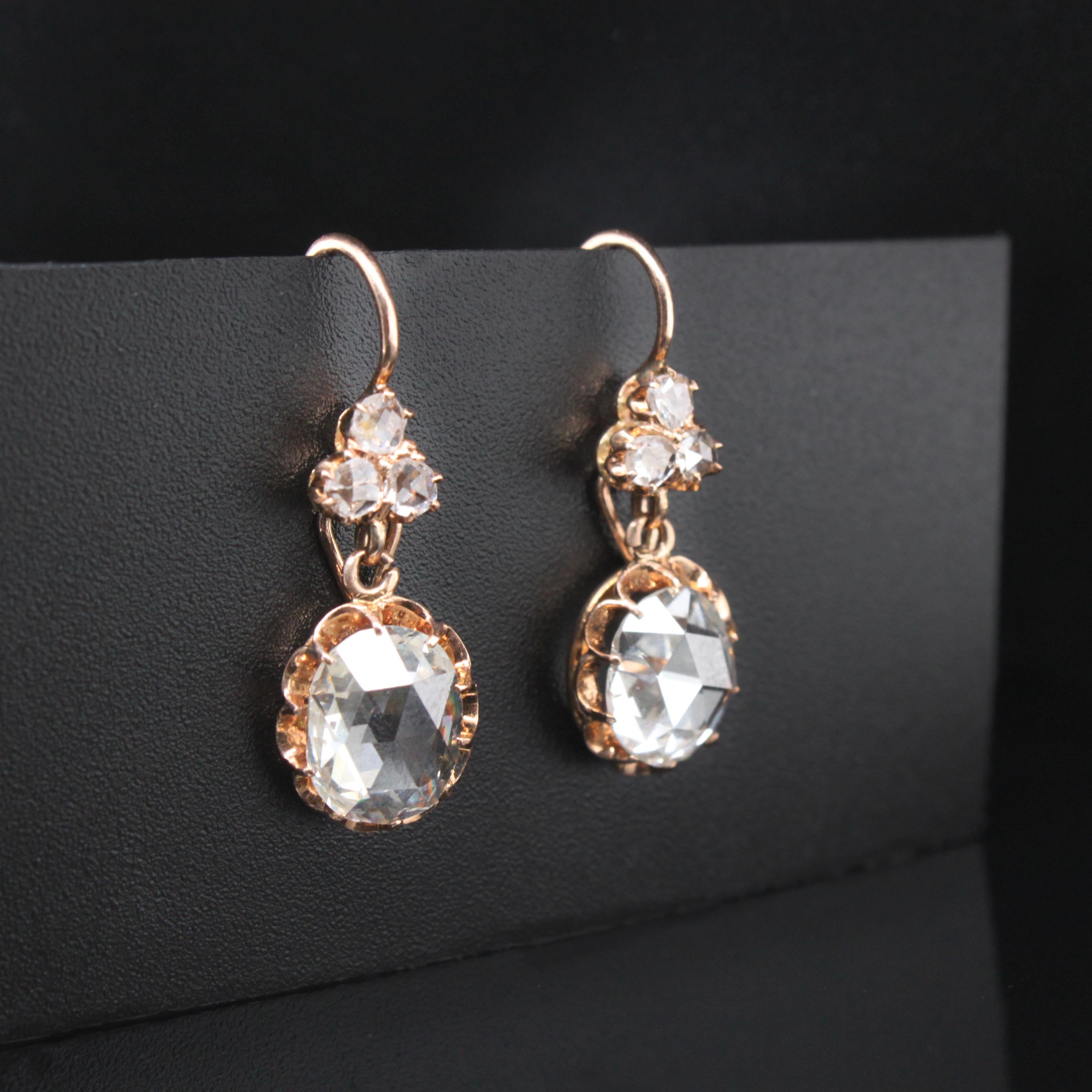 Russian Rose-cut Diamond Earrings, ca. 1890s

A very pretty pair of rose-cut diamond earrings with rose-cut diamonds of 1.17 and 1.32 carats (ca. I-J/VS-SI), suspended from a trefoil of small rose-cut diamonds, with hoop earrings and