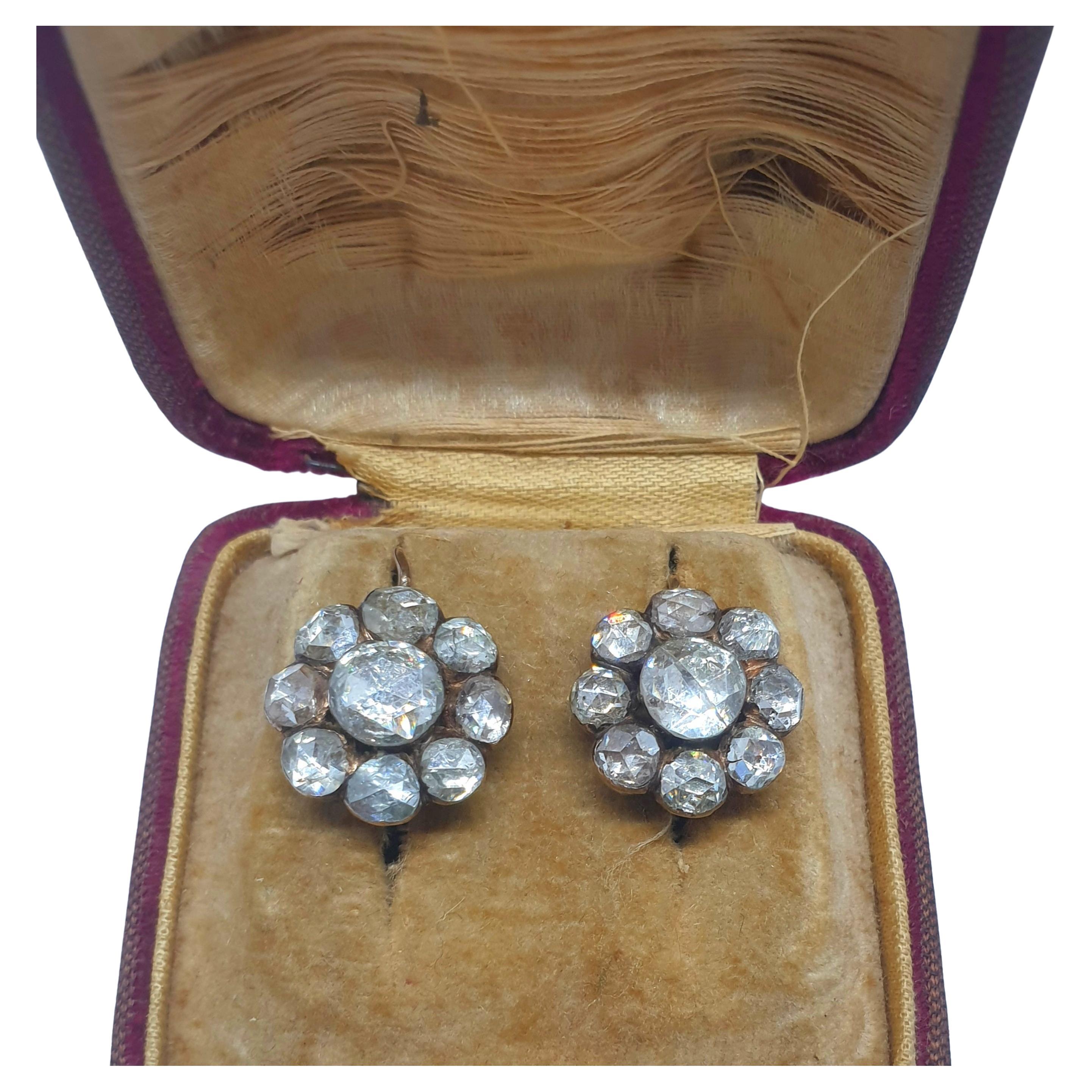 Antique rose cut diamond earrings in floral design with large rose cut diamonds with a total estimate diamond weight of 11 carats center stone diameter 7.30mm/ smaller stone diameter 5.30mm and earing head diameter 15.70 mm back foiled old technique