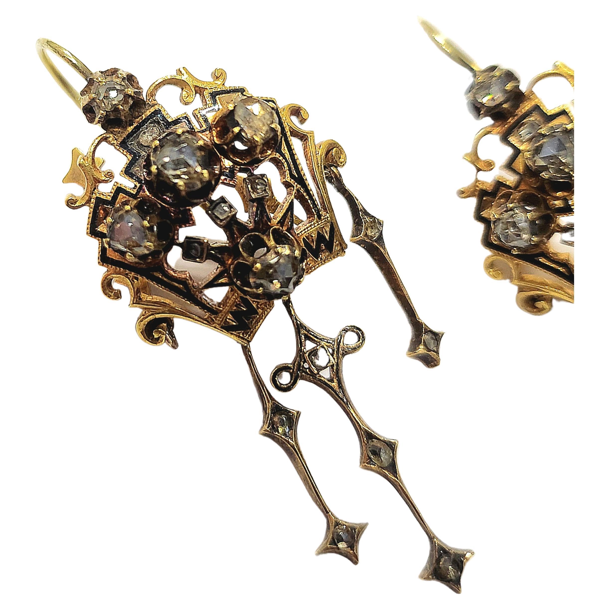Victorian era long dangling gold earrings with rose cut diamonds estimate weight 2 carats and black enamel earrings dates back to 1850.c 
