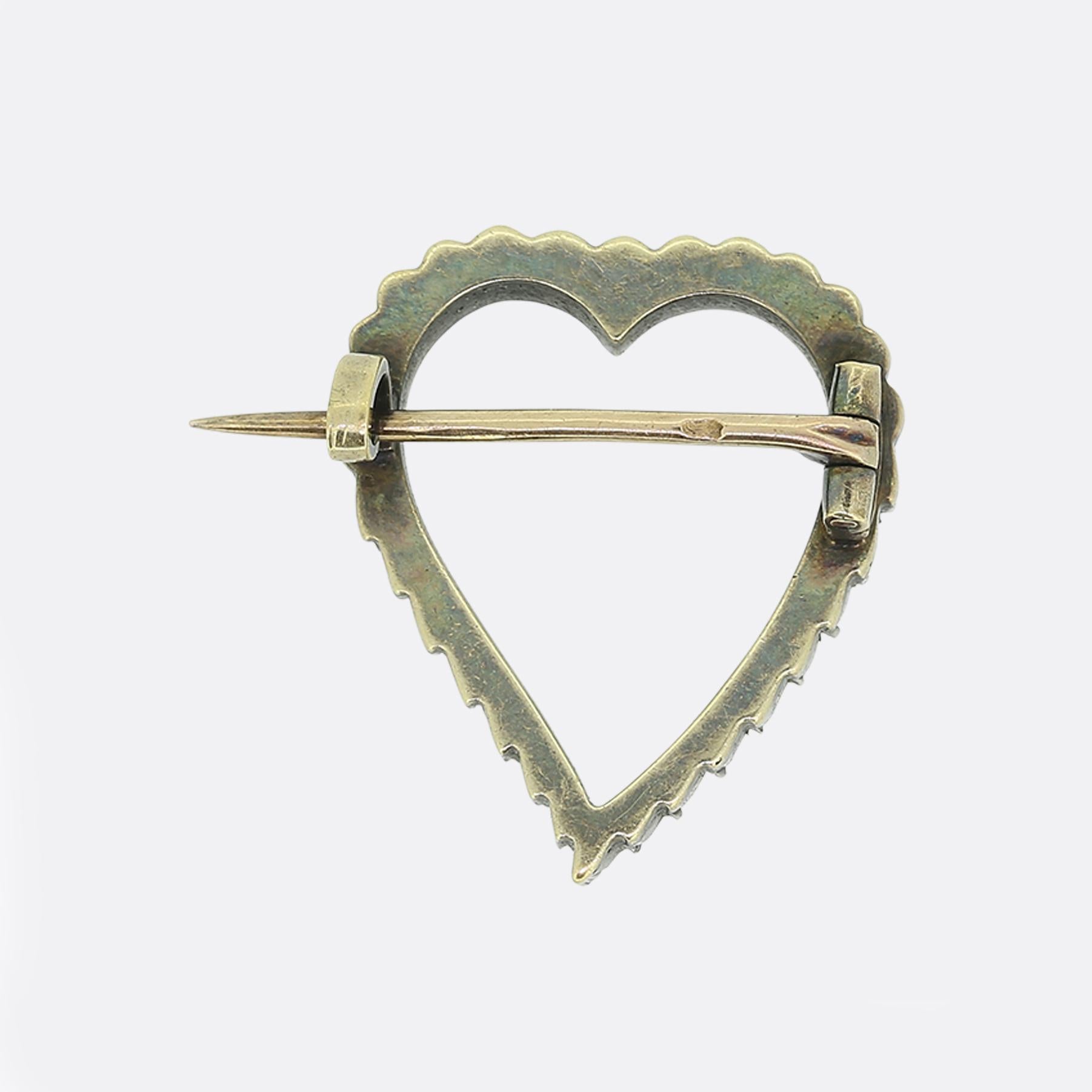 Here we have an elegant heart brooch that dates back to the Victorian era. The brooch is crafted in 18ct gold with a silver setting for the rose cut diamonds. The pin has a French eagles head assay mark signifying 18ct gold.

Condition: Used (Very