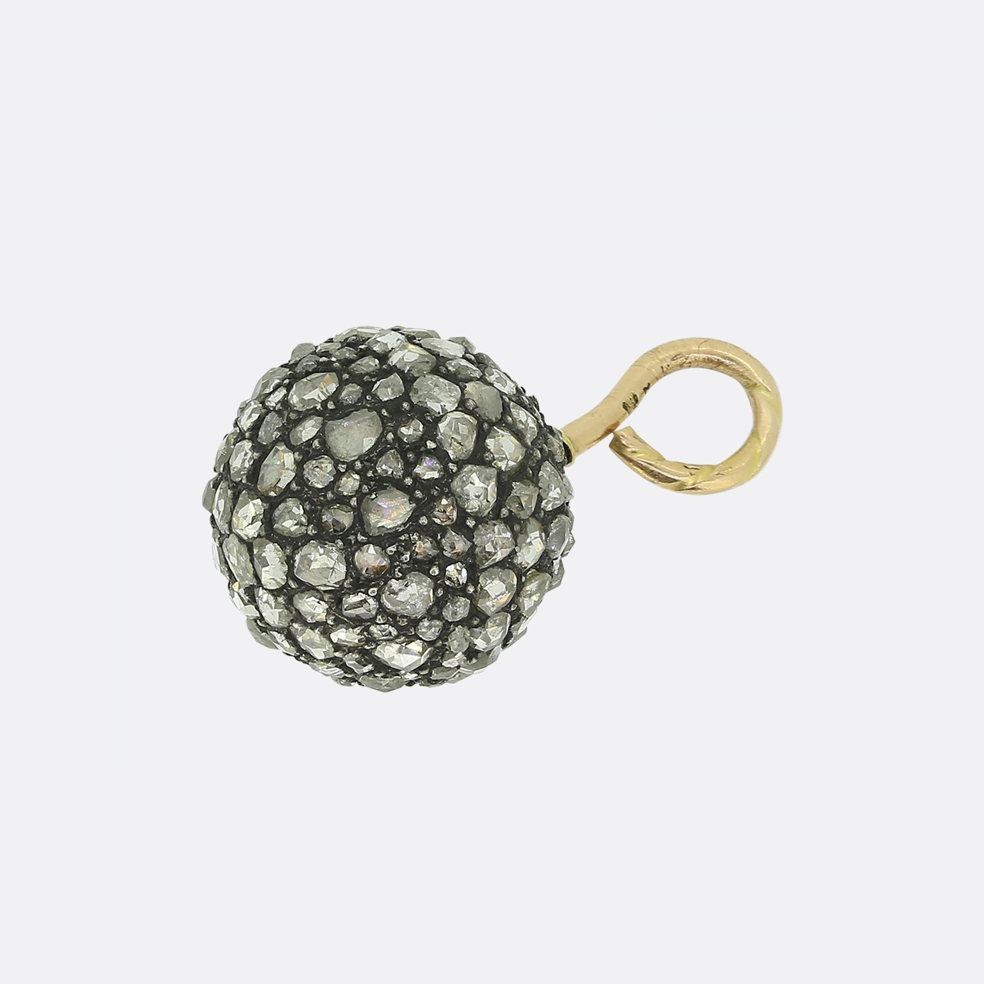 Here we have a shimmering pendant taken from the Victorian era. Every aspect of this spherical piece has been adorned with a vast ensemble of rose cut diamonds of differing shapes and sizes. Possessing the same qualities of a modern-day disco ball,