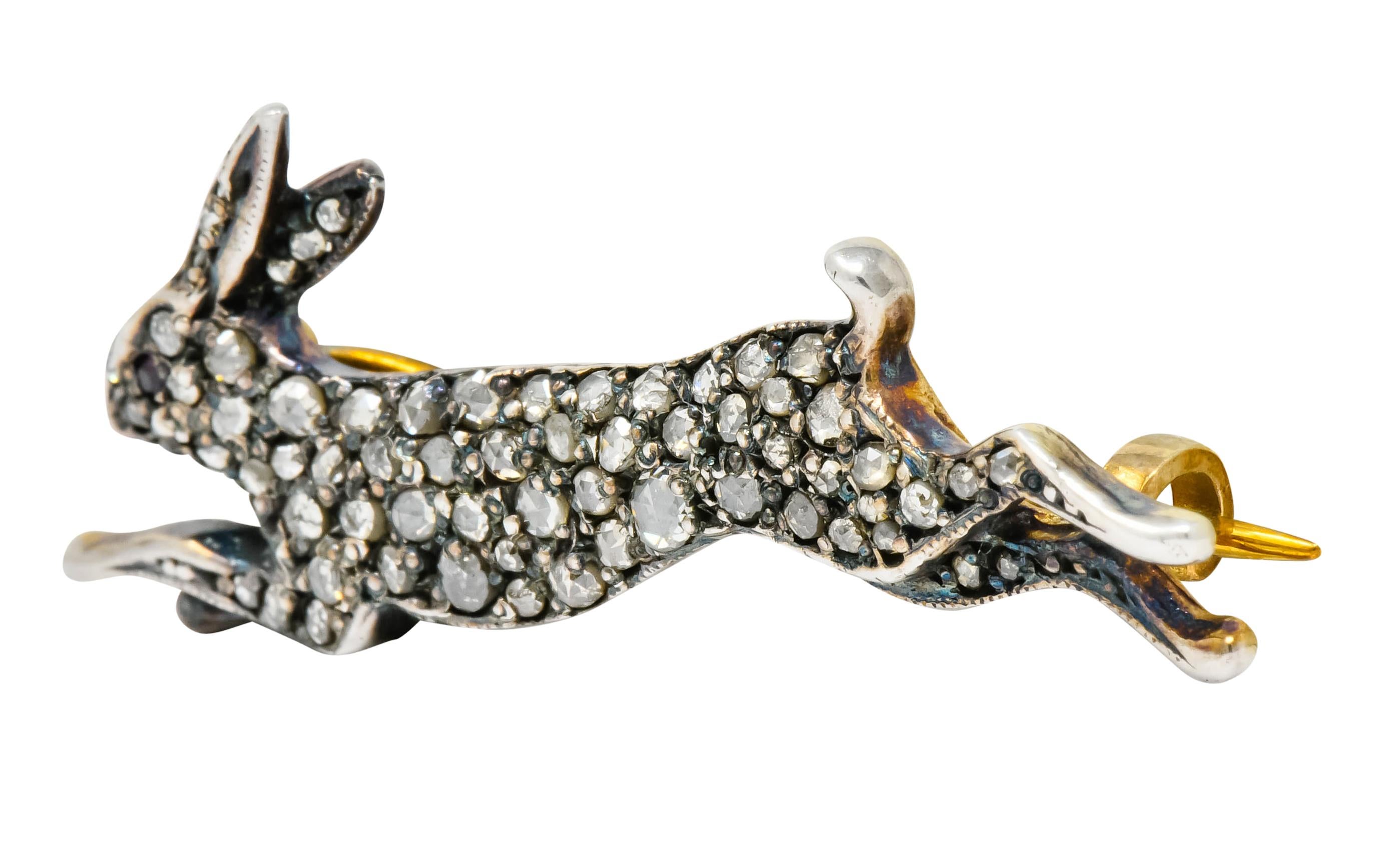 Brooch designed as a silver topped hare, mid leap, bead set throughout by rose cut diamonds

Accented by round cut ruby eye and some milgrain detail

Completed by pin stem and closure

Tested as silver-topped 10 karat gold

Measures: 5/8 x 1 5/8