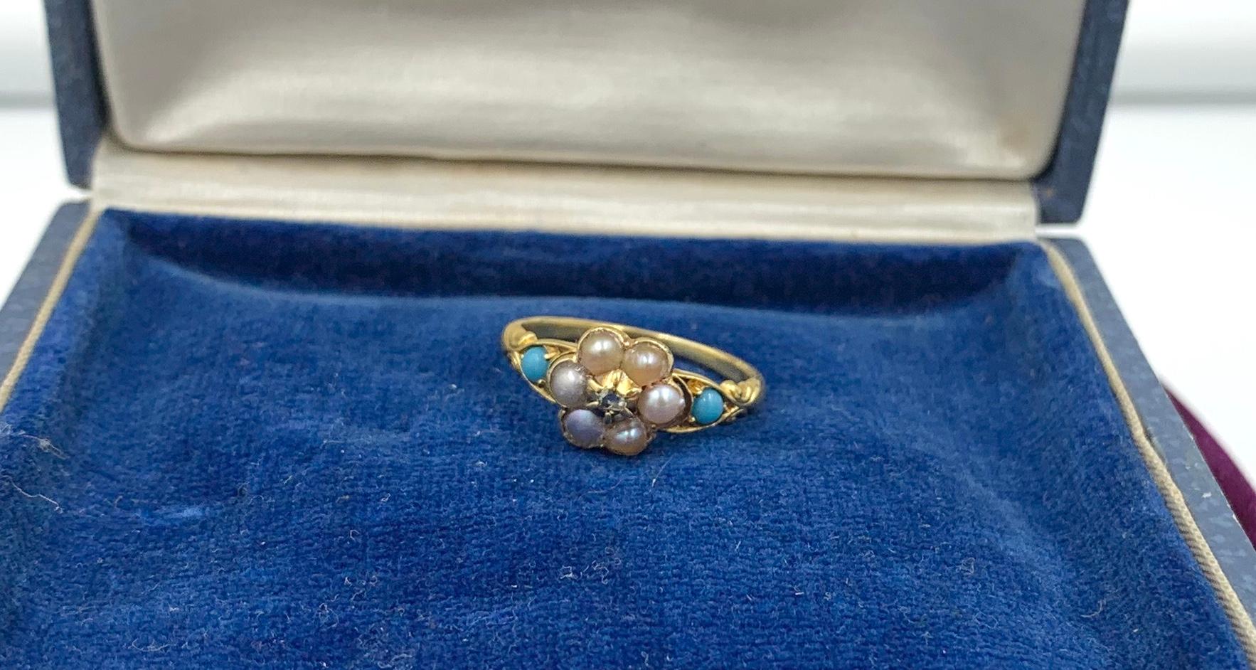 An stunning and oh so Romantic Antique Victorian Ring with a Rose Cut Diamond, a halo of Pearls and two Persian Turquoise gems. The combination of Diamond, Pearls and Turquoise in this beautifully made ring is an absolute delight.  The Rose Cut