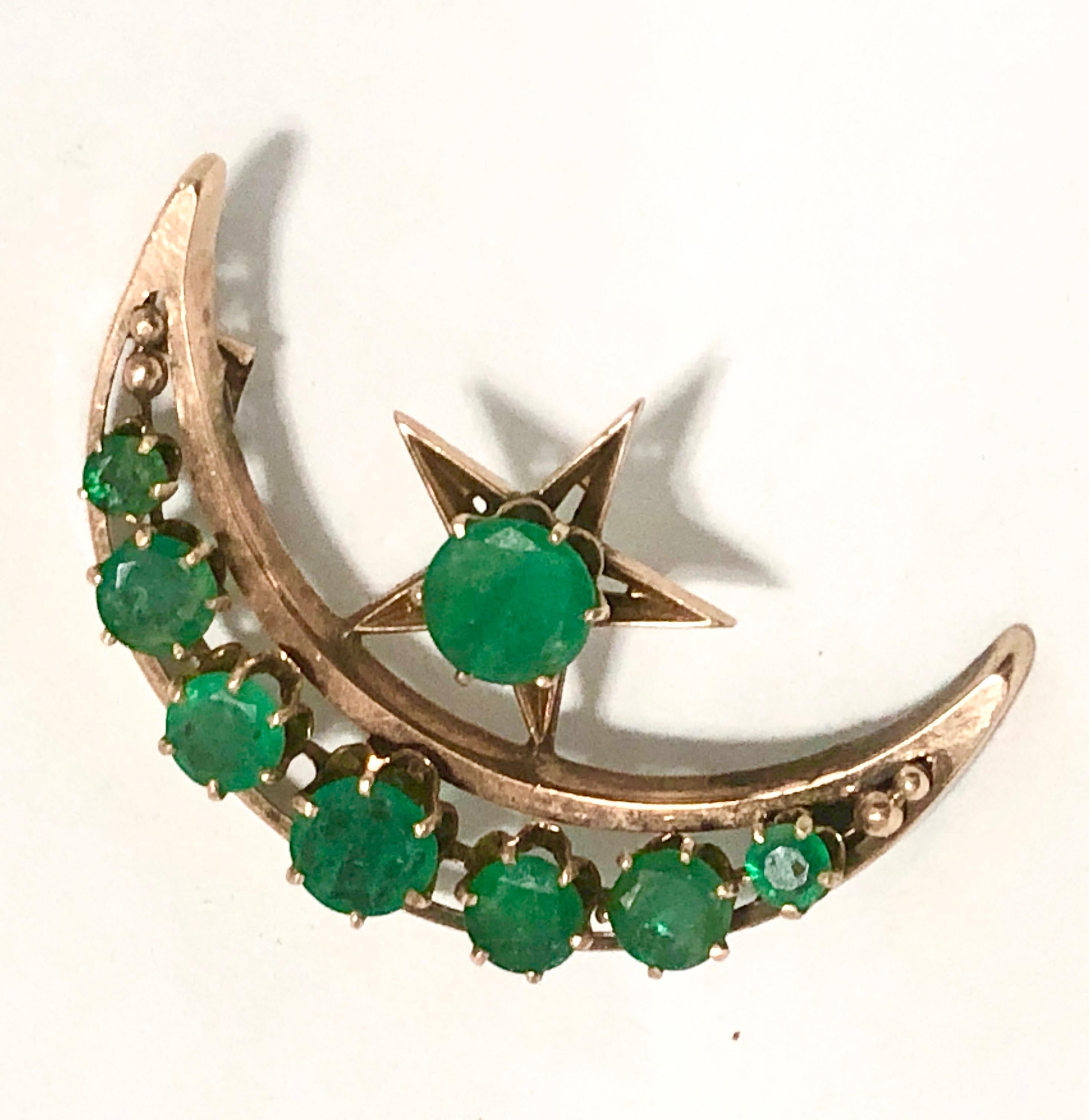 Spectacular emerald and 10k rose gold Victorian crescent pendant in the popular moon and star motif..  (Chain can be attached if you wish to your measurement.)

The pendant is approximately 1.5