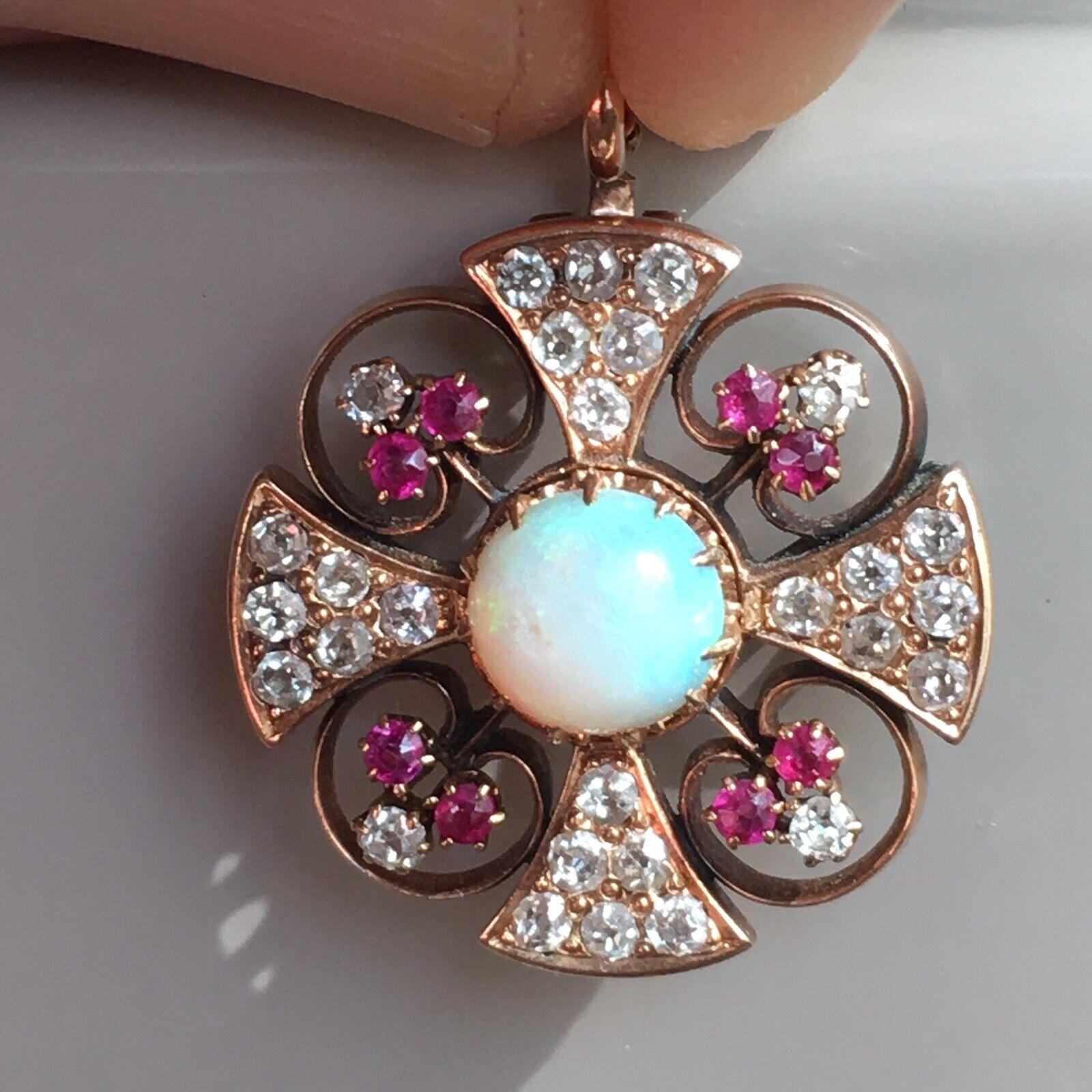 Victorian Rose Gold Diamond Opal Ruby Pendant-Brooch 1890s American

Excellent Condition

Original American Antique 130 Yrs old


Victorian pendent-brooch circa 1890s 14 Karat gold, Old Cut Diamonds, Ruby and Opal( 6.7 mm high doom round cabochon