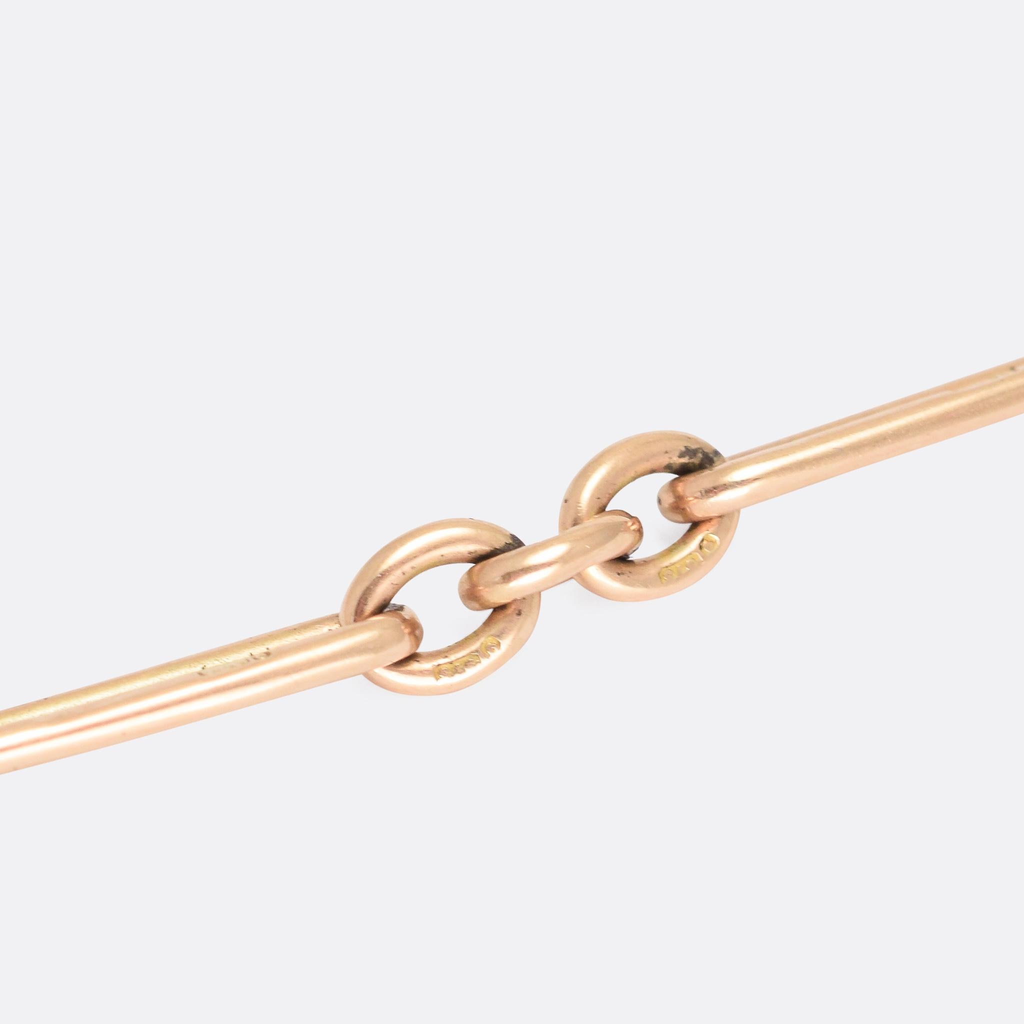 A chunky Victorian trombone link chain in solid 9k rose gold. It dates from the late 19th Century, circa 1880, and it's long enough to wear as a short necklace, or doubled up as a bracelet. With both ring bolt and swivel fastener, and an articulated