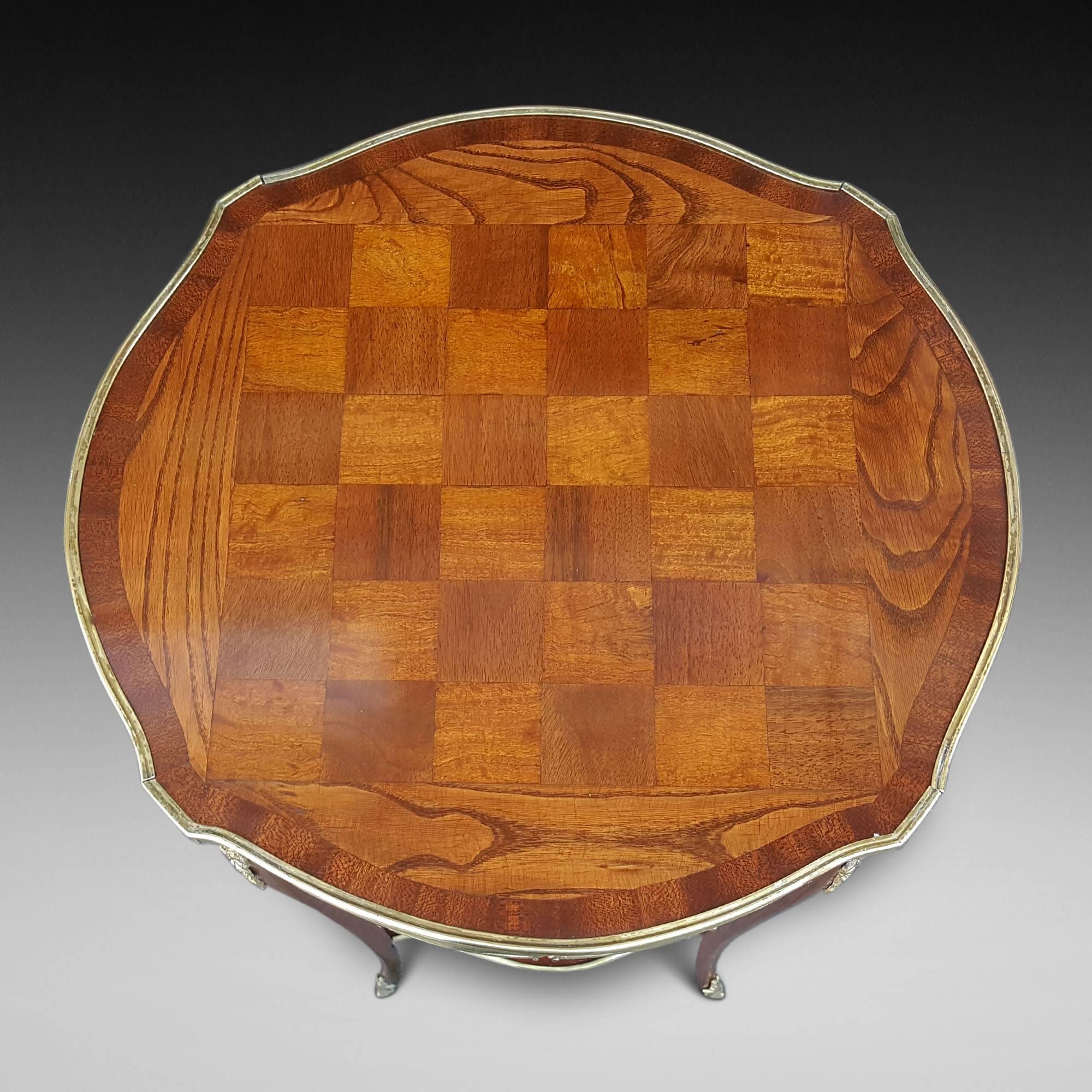 Victorian rosewood and satinwood chess games table, with gilt metal side mounts, cabriole legs and low shelf
Measures: 18