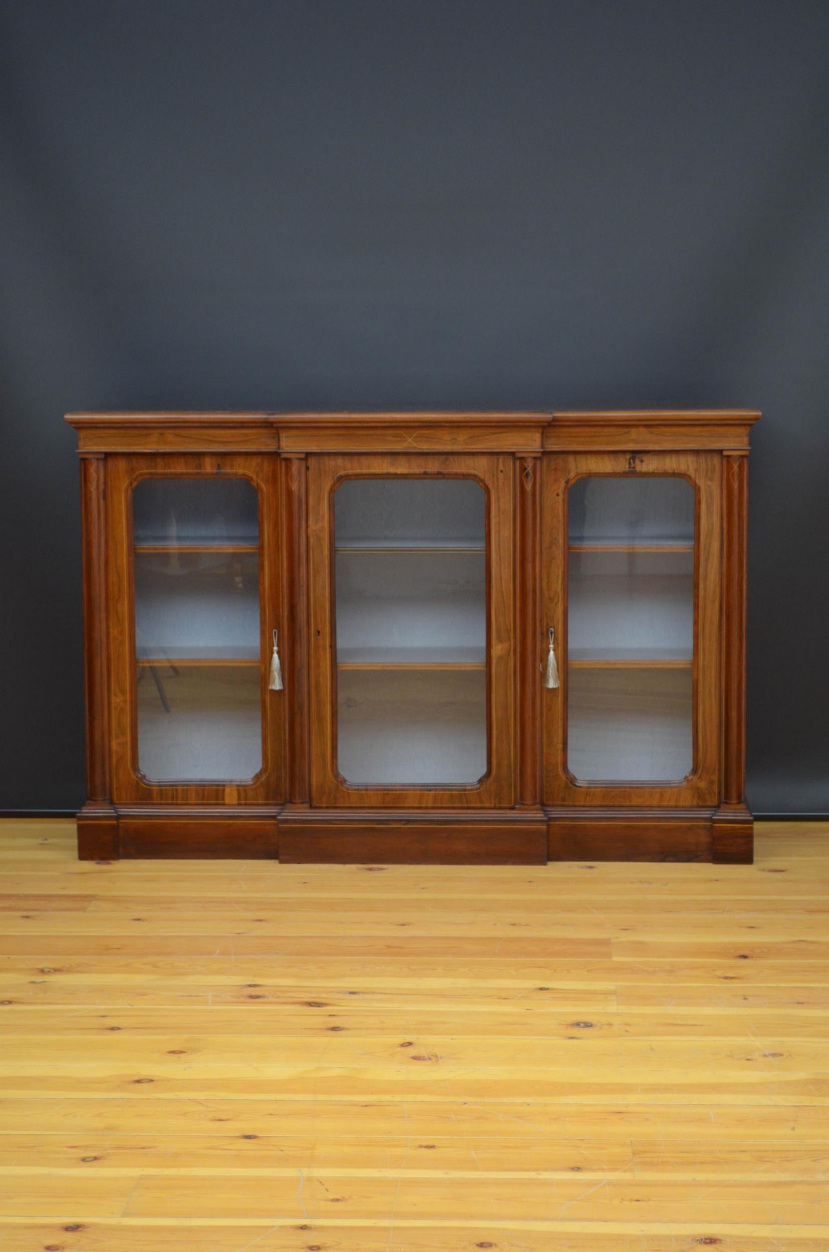 Sn5091 fine quality Victorian rosewood credenza / bookcase, having satinwood string inlaid top with moulded edge above string inlaid frieze and projecting centre door flanked by further glazed doors, all fitted with original working locks and