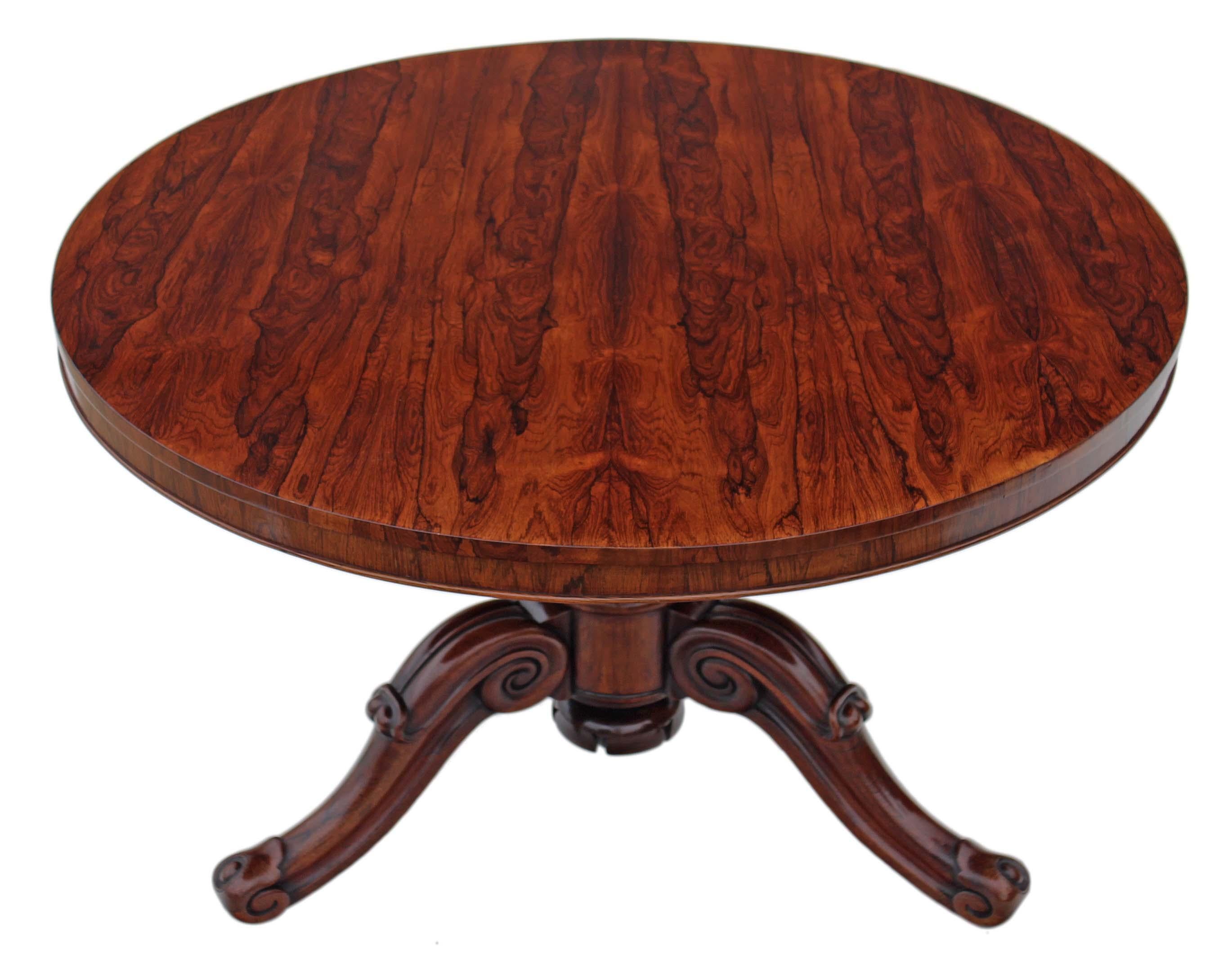 Antique fine quality Victorian 19th century rosewood loo, breakfast or centre table with a tilt-top.
Solid, heavy and with no loose joints. Breath-taking quality matched rosewood veneer on mahogany top, beautifully carved solid rosewood