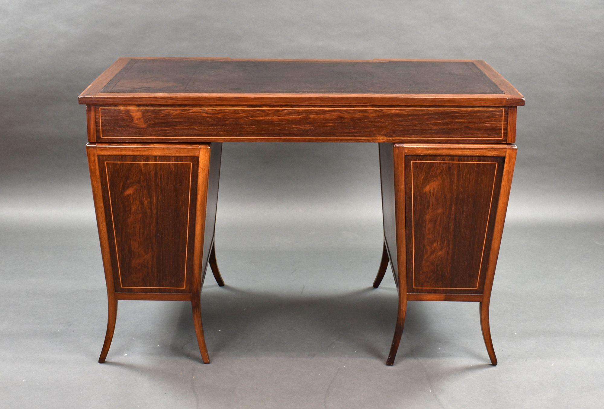 For sale is a good quality Victorian rosewood pedestal desk, having a leather inset top, above three drawers each with brass handles. The top fits on to two tapered pedestals each with a further three drawers, raised on splayed legs. The desk