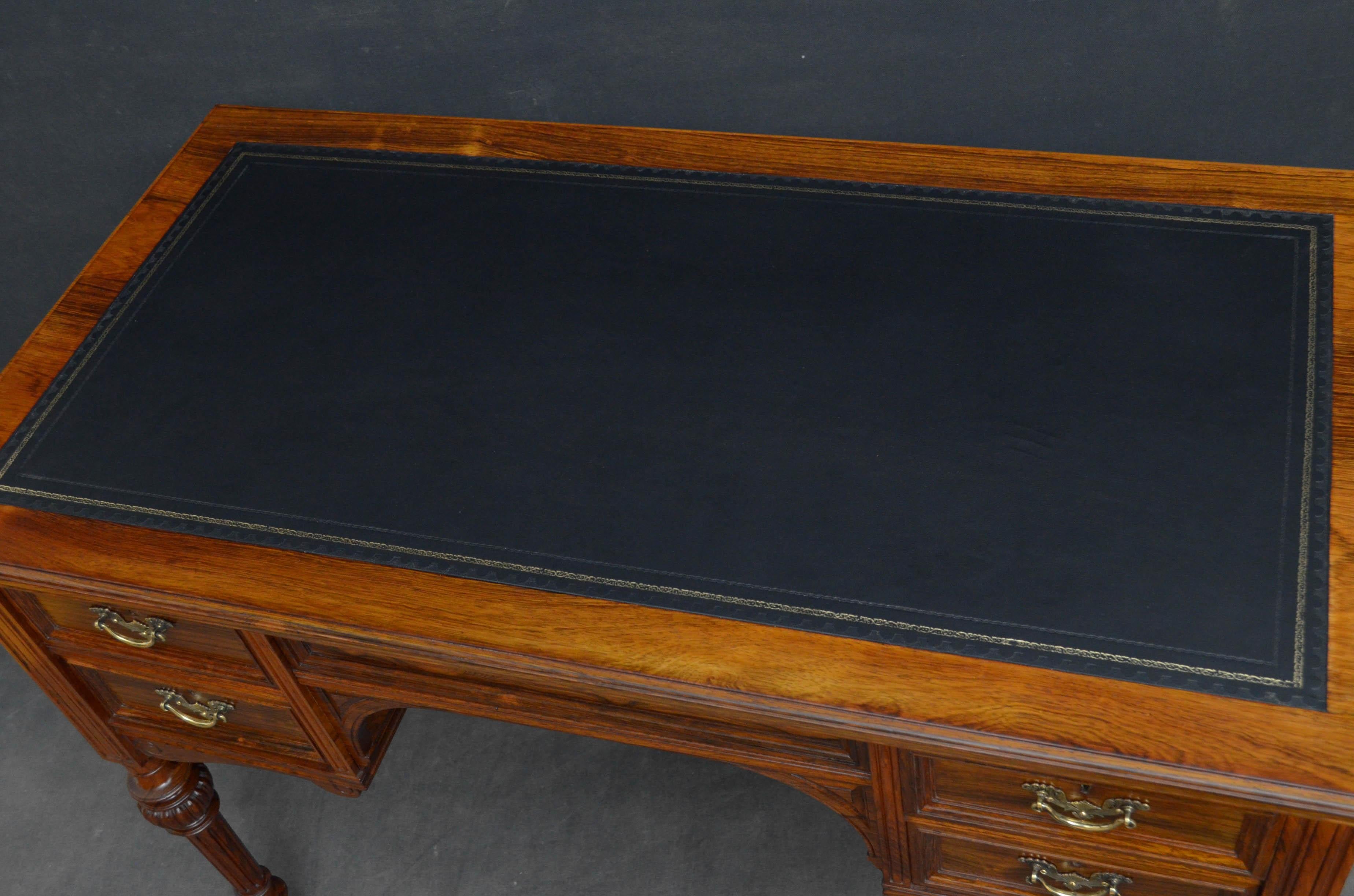 Sn4755, superb quality Victorian writing table in rosewood, having black tooled leather writing surface above panelled frieze and 4 mahogany lined moulded drawers, all fitted with original brass handles, all standing on turned, carved and reeded