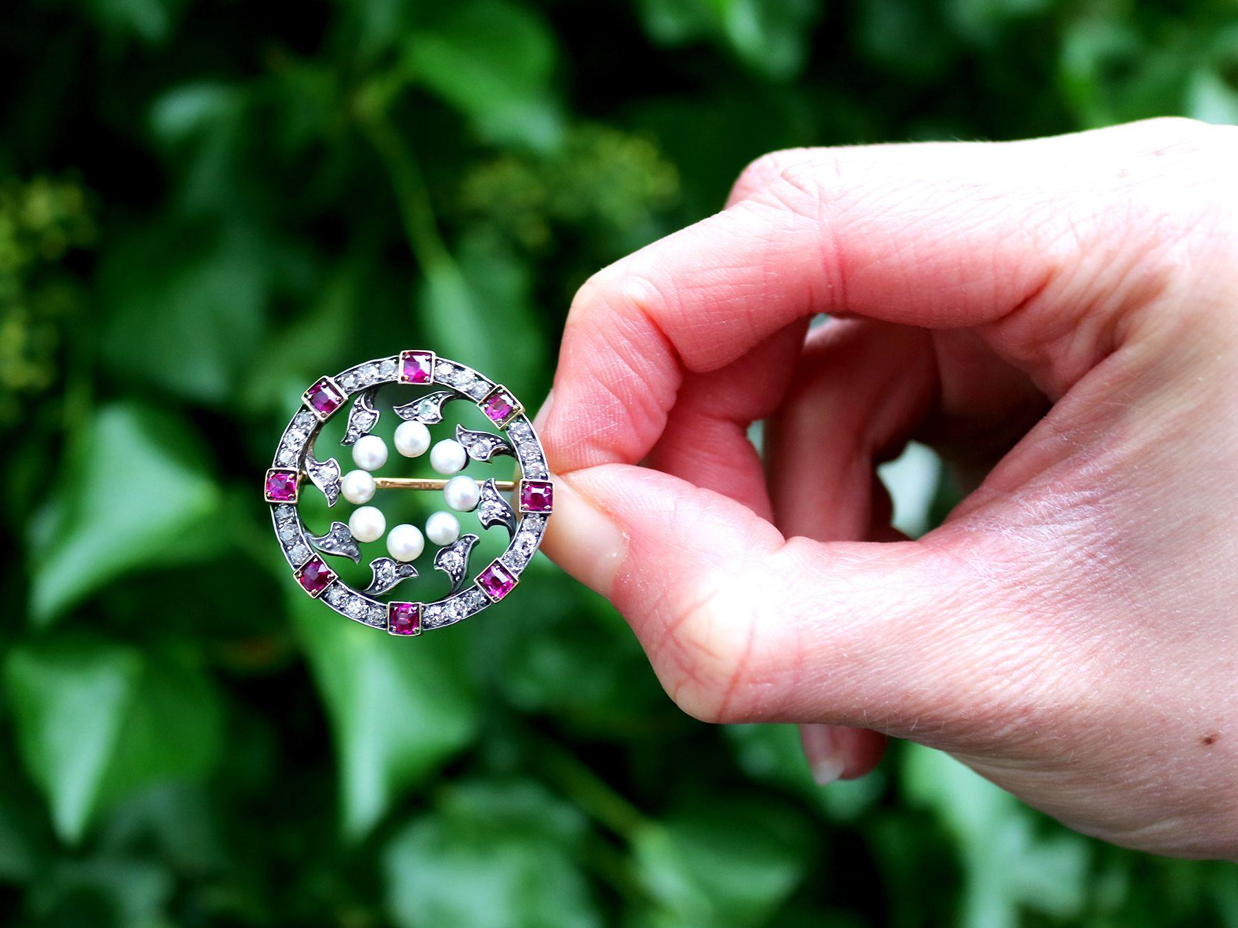 A stunning, fine and impressive 1.54 carat diamond, 1.09 carat ruby and natural pearl, 12 karat yellow gold and silver brooch; part of our diverse vintage jewellery collections.

This stunning, fine and impressive Victorian brooch has been crafted