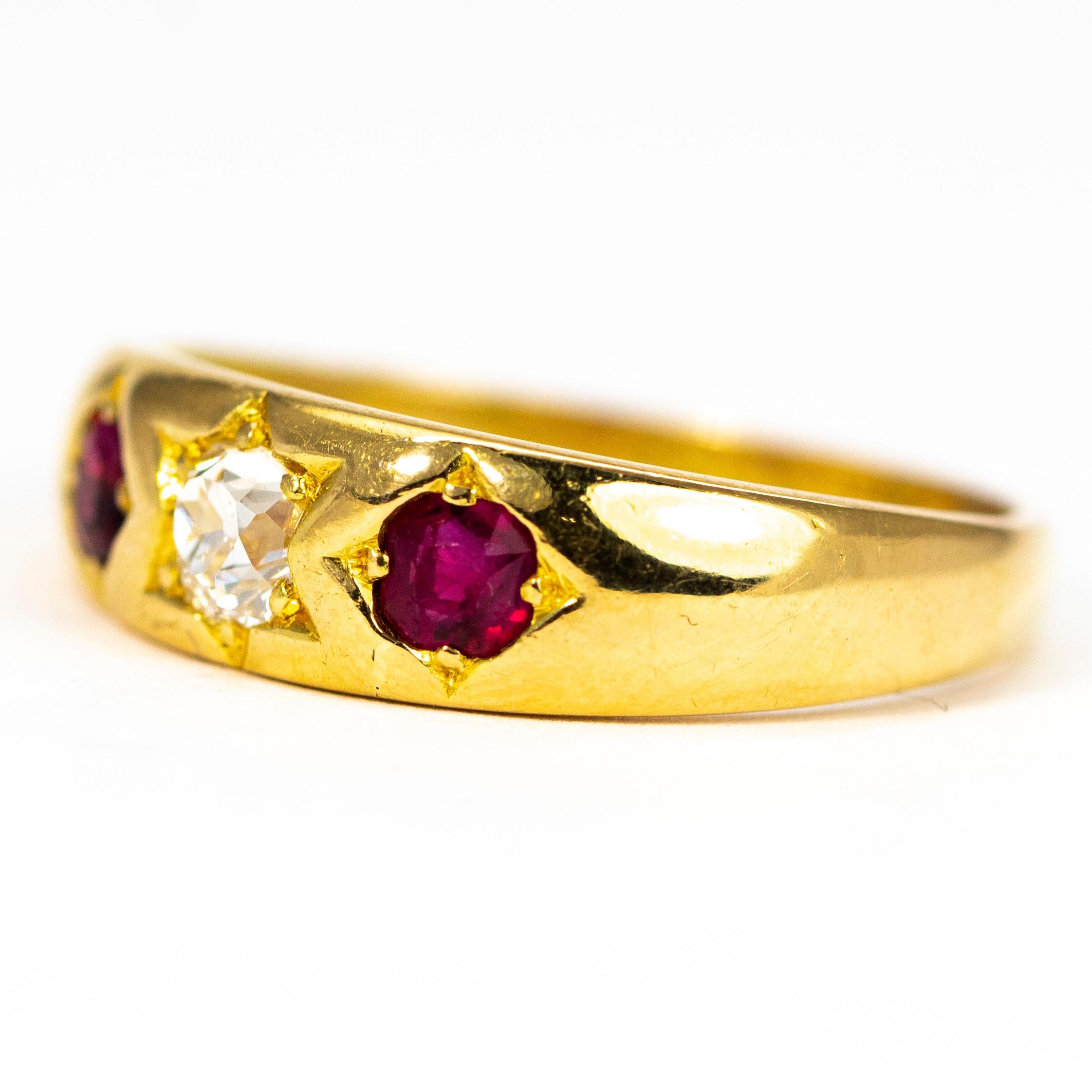 This three stone band features a diamond at the centre measuring 30pts and is H colour SI2 with rubies either side measuring 20pts each. Made in Birmingham, England 1875.

Ring Size: P 1/2 or 8

Weight: 4.5g