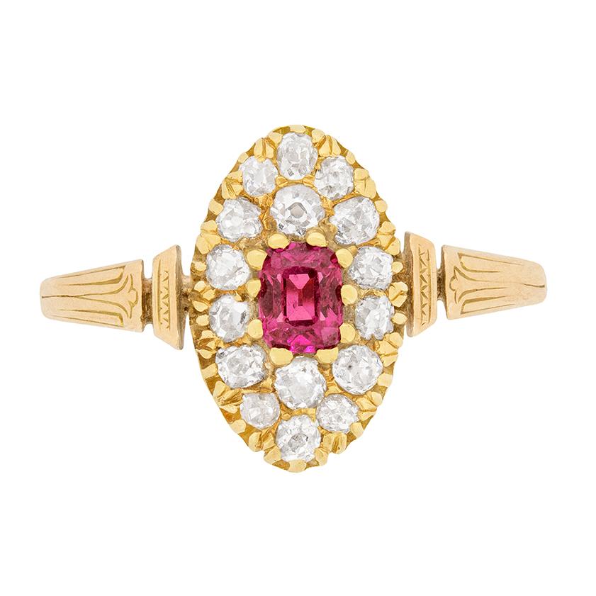 Dating to the 1900s, this Victorian dress ring features a centre ruby weighing 0.35 carat. It is a natural stone with a strong red colour, with pink hue. It is surrounded by a cluster of old cut diamond, totalling to 0.80 carat. They are estimated