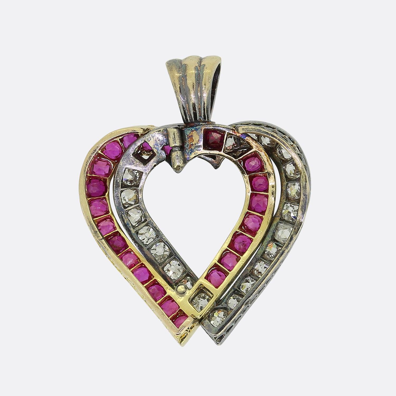 Here we have a gorgeous ruby and diamond heart pendant dating back to the Victorian period. This antique piece has been crafted from both 18ct yellow gold silver with each frame overlapping to form the shape of an open love heart. The silver half
