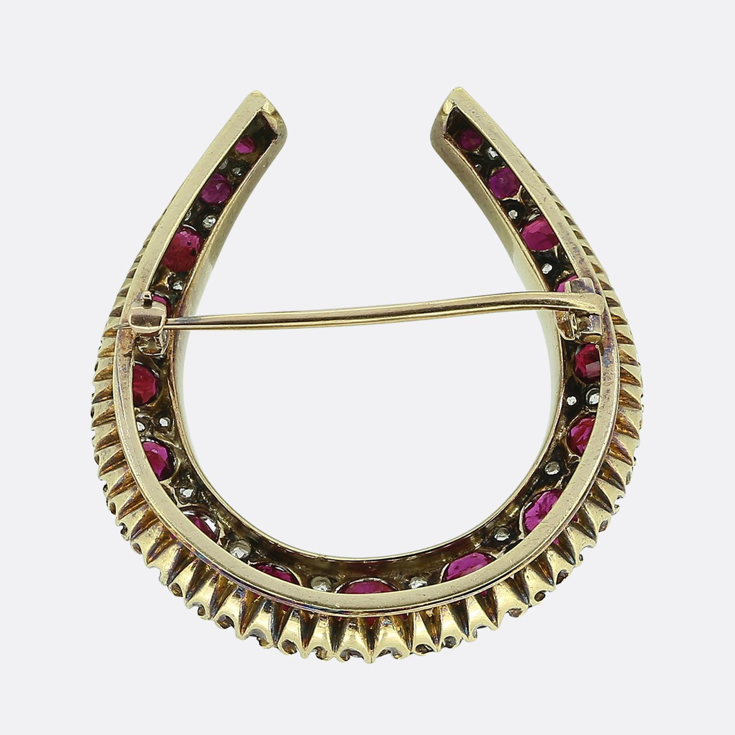 Here we have a classically styled horseshoe brooch taken from the Victorian era. The motif has been superbly crafted from 18ct yellow gold and plays host to 17 excellently matched rich red rubies; all of which graduate in size towards the centre and
