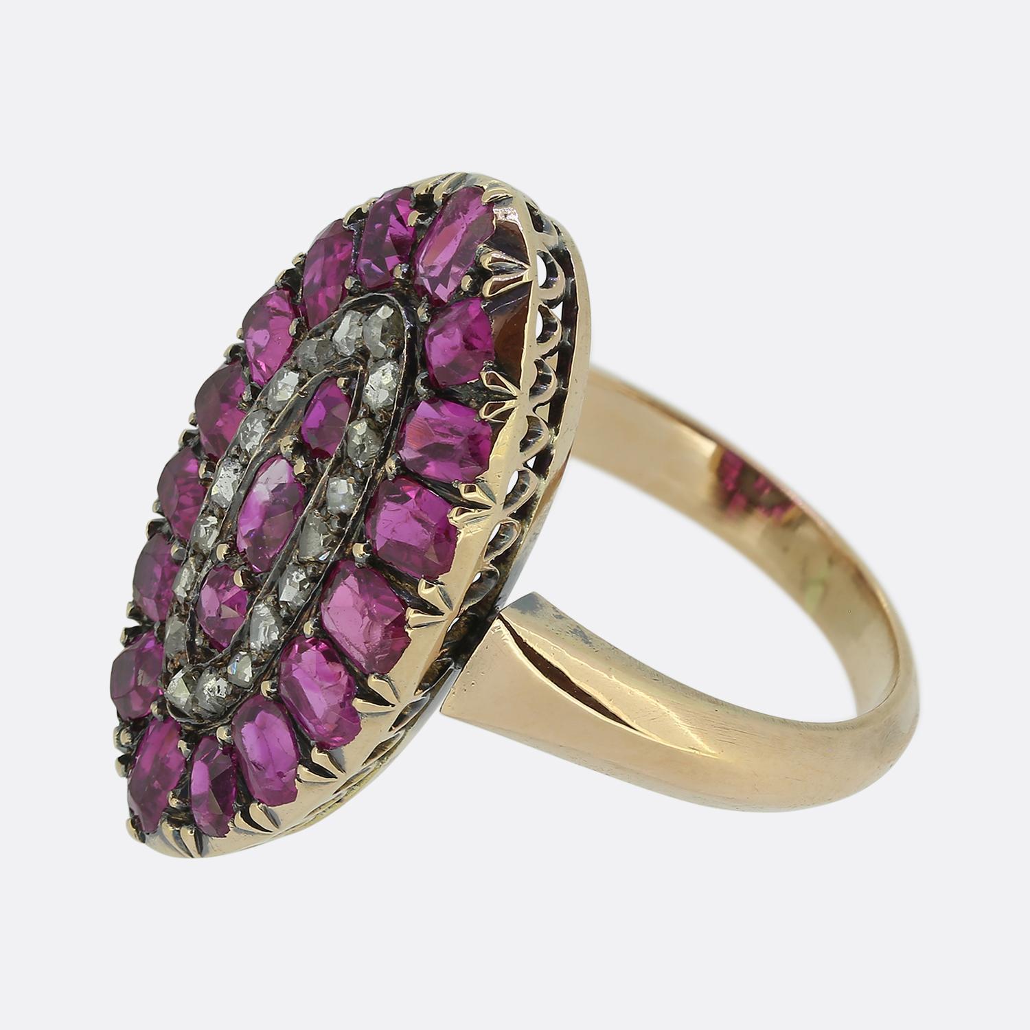 Here we have a breathtaking antique cluster ring focally showcasing a stunning array of rich pink rubies. The navette design is accentuated by a trio of vertically set rubies at the centre of the face with perfectly matching stones pervading the