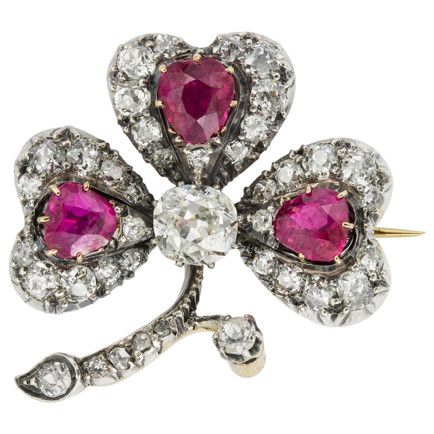 An Early 20th Century Ruby And Diamond Clover Brooch For Sale