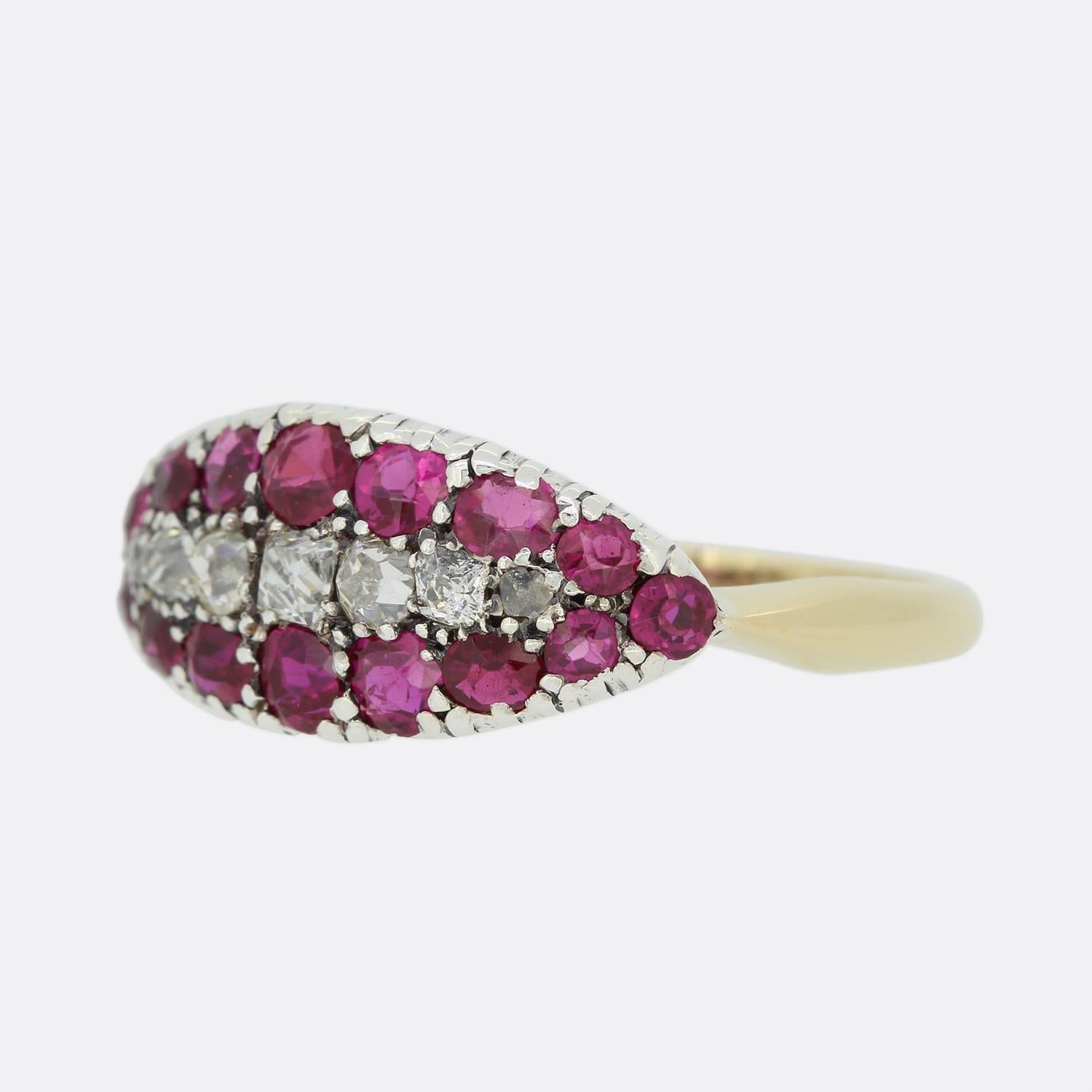 This is a wonderful 18ct yellow gold Victorian ruby and diamond three row band. The ring consists of a central row of old cut diamonds with two outer rows of rubies. The stones rest in simple scalloped claws, the rubies are an intense rich red hue,