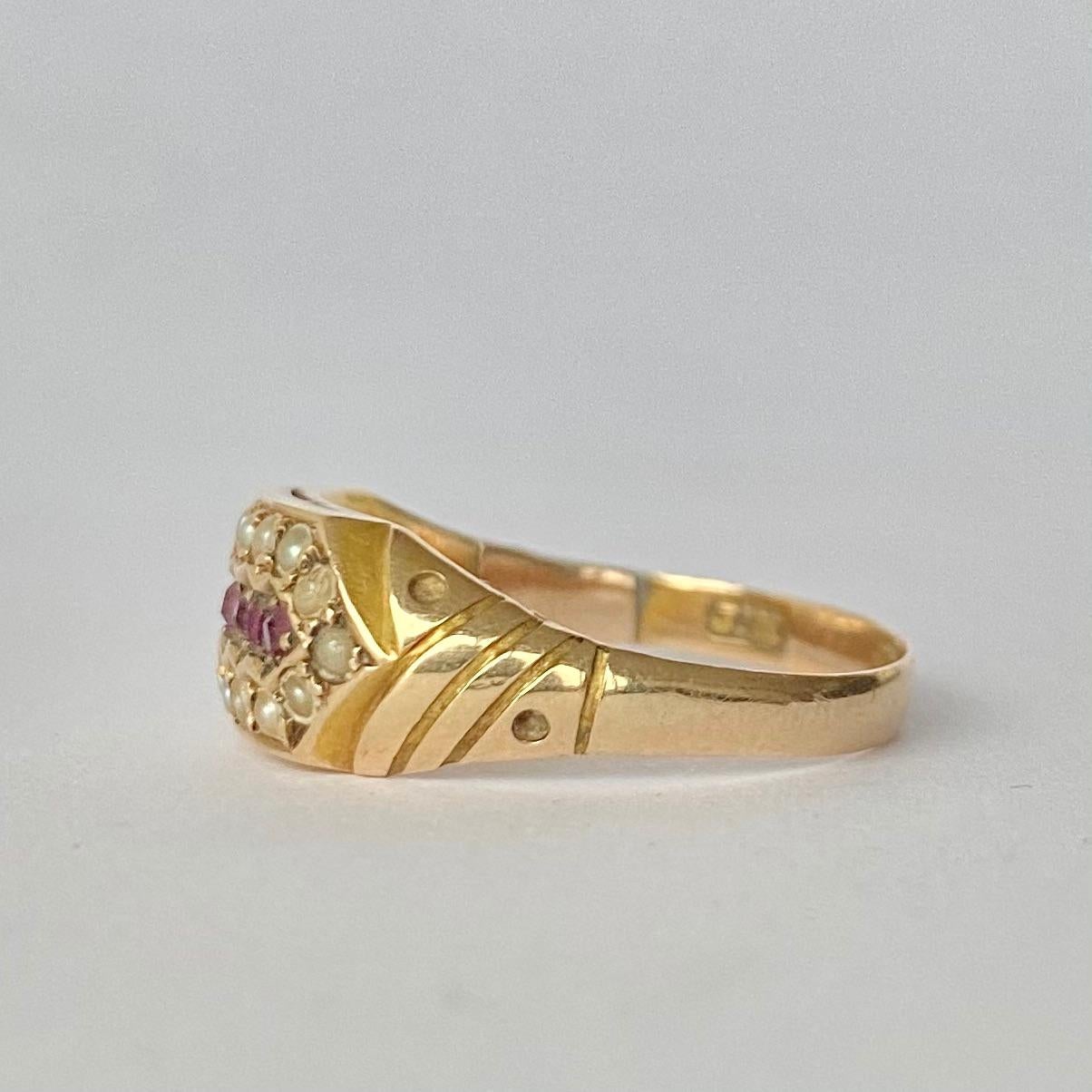 Surrounding the row of bright red rubies are shimmering pearls. Modelled in 15carat gold and made in Birmingham, England.

Ring Size: N 1/2 or 7 
Band Width: 7.5mm 

Weight: 2.2g