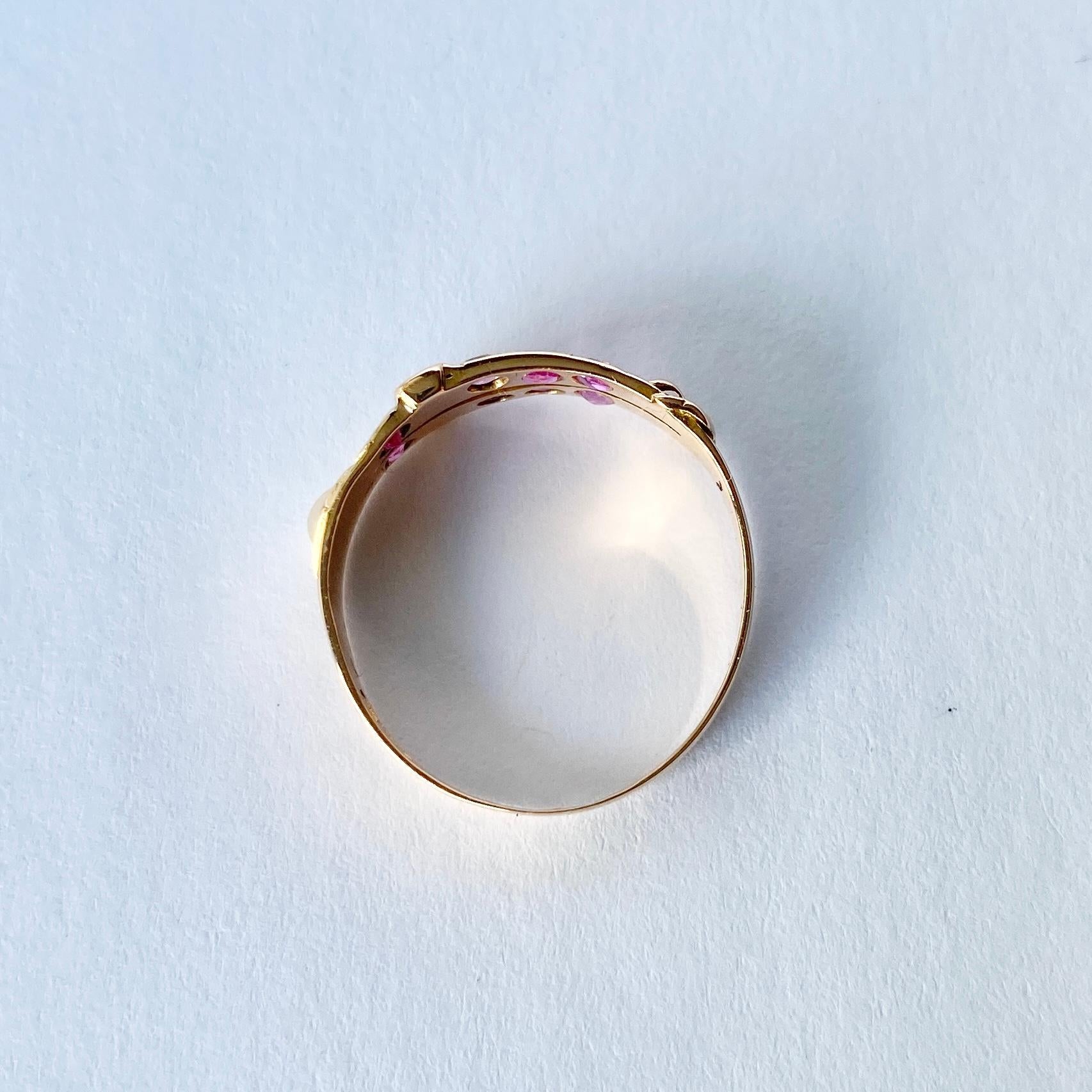 This sweet ring holds a total of approx 20pts. There also pearls set into the ring. The 18carat gold is beautifully crafted into a double buckle design. Fully Hallmarked Birmingham 1876.

Ring Size: L 1/2 or 6 
Band Width: 6mm

Weight: 1.5g