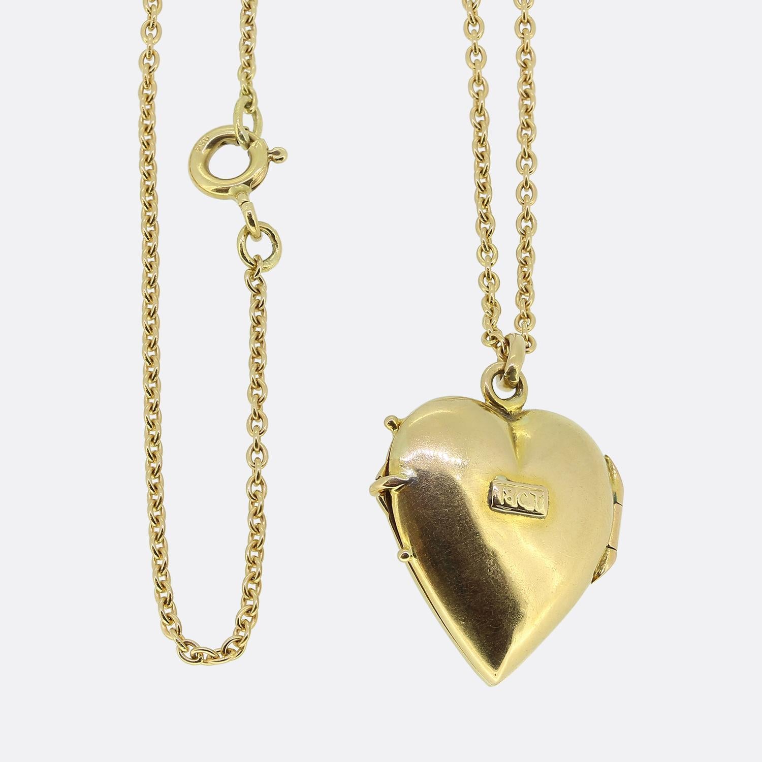 Here we have a romantic ruby and pearl set locket necklace. This antique pendant has been crafted from 18ct yellow gold into the the shape of a little love heart and expertly set with an array of round rubies and natural pearls in a floral