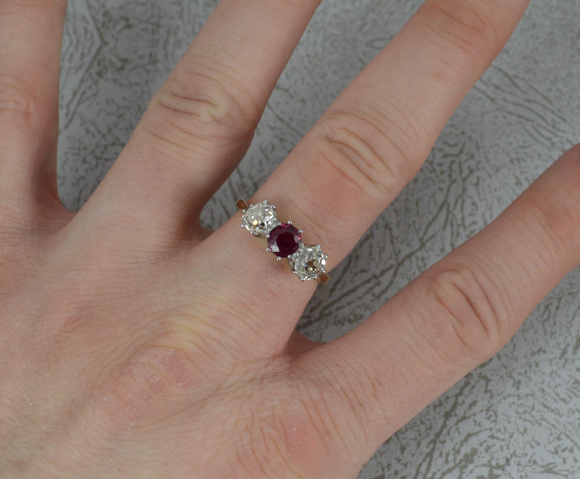 A superb Ruby and Diamond trilogy ring, circa 1890.
18 carat yellow gold shank and platinum head setting.
Designed with a natural ruby to centre, 4.9mm x 5.3mm approx. Stunning colour.
To each side are vs clarity, clean and sparkly natural diamonds,