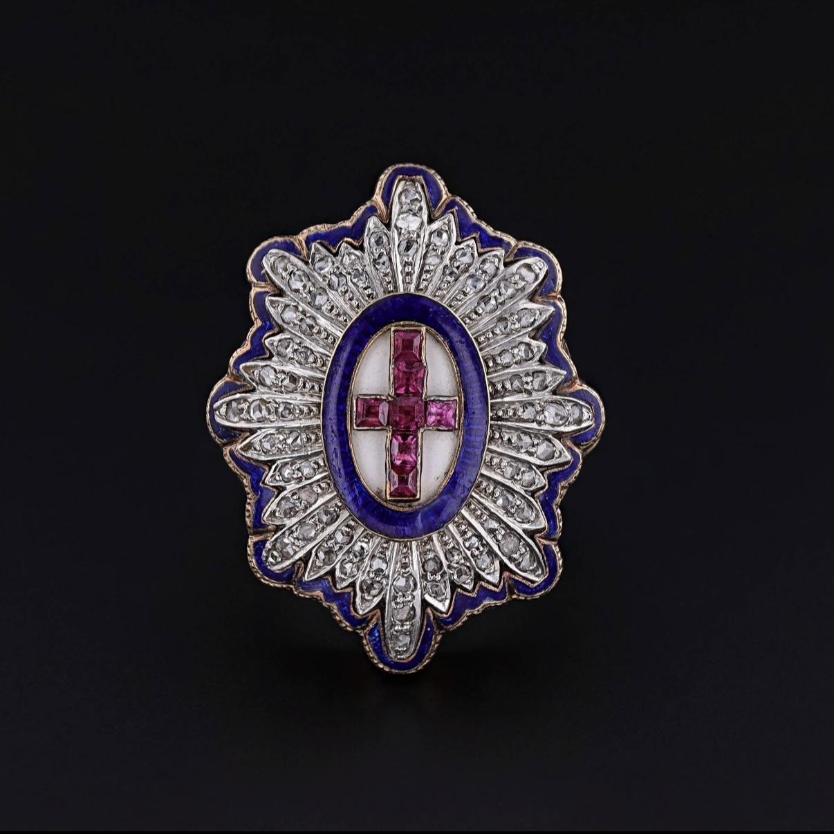 Victorian Ruby Cross Ring in 14k Rose Gold with Enamel and Diamonds, Circa 1860

This magnificent and substantial Victorian era ring, dating to around 1860, is a stunning example of period craftsmanship and symbolic design. At its center, a vivid
