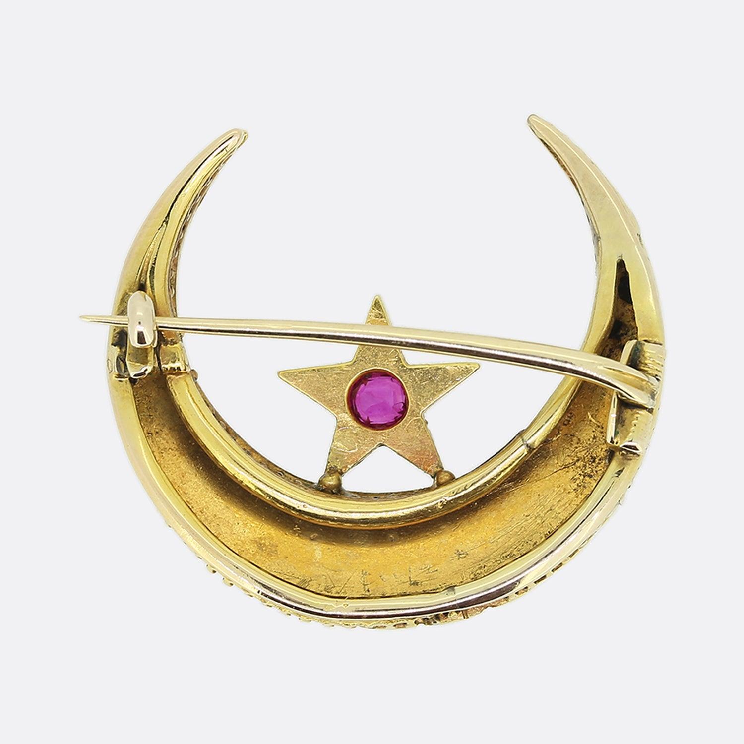 This is a wonderful antique ruby, diamond and pearl crescent brooch. Crafted in 15ct yellow gold during the late Victorian era, the focal aspect of this brooch is the centralised star set ruby surrounded by a quintuplet of rose cut diamonds. The