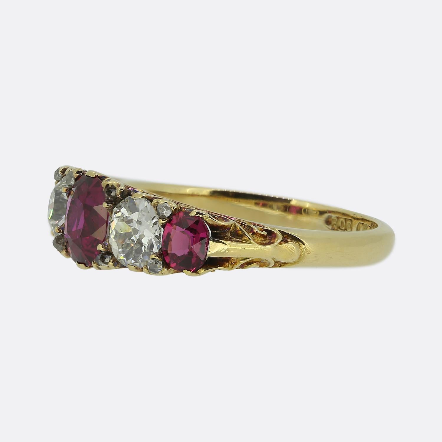 This is an antique ruby and diamond five stone ring from the later part of the Victorian era. The gemstones graduate inwardly in size with a single oval shaped ruby sitting at the centre. A sizeable old cut diamond separates each round ruby with