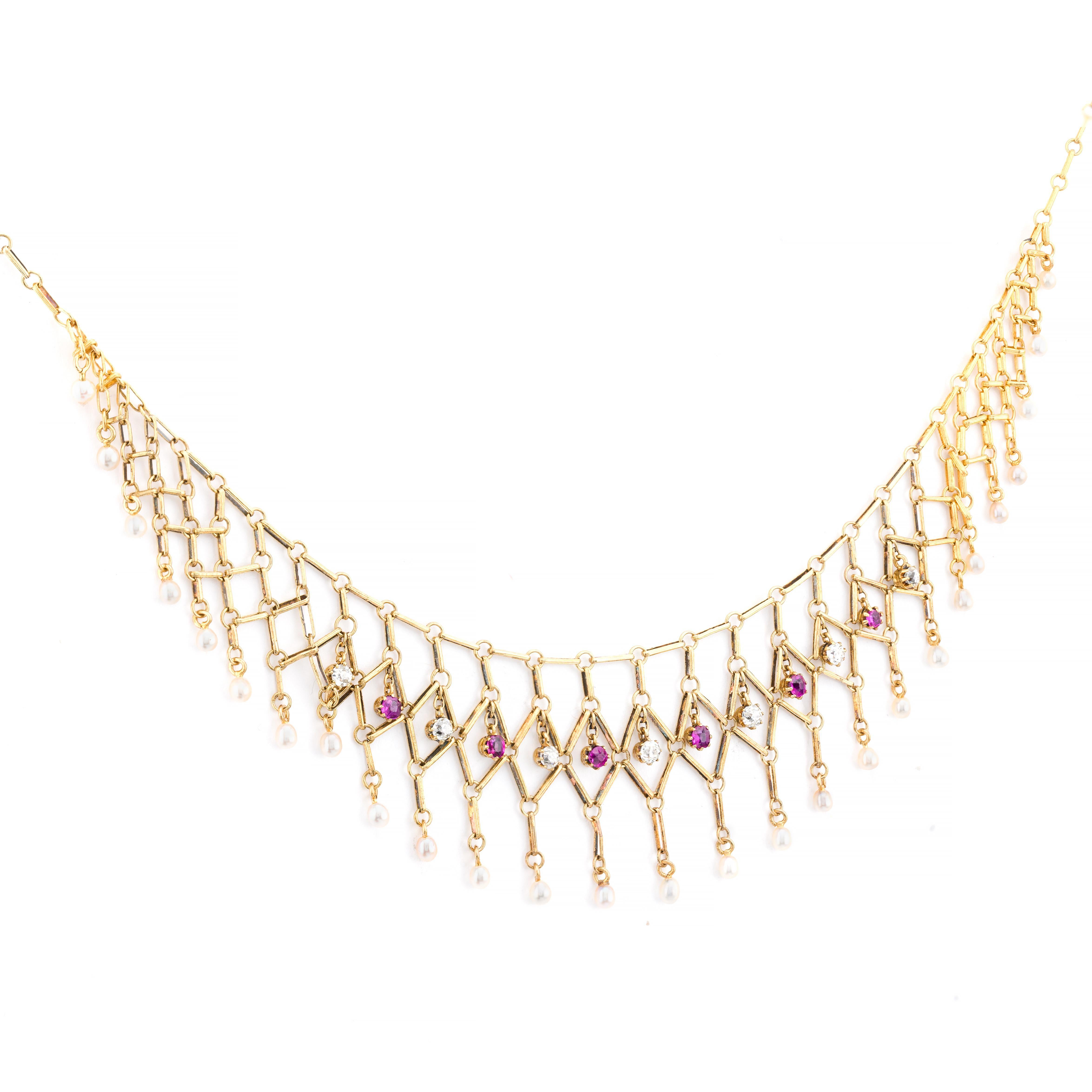 Victorian Elegance Collection Presents:

A stunning Victorian necklace crafted in 18k yellow gold. 

This exquisite piece showcases a delicate lattice design adorned with old mine cut rubies and diamonds. 

The rubies, totaling 0.34 carats, exhibit