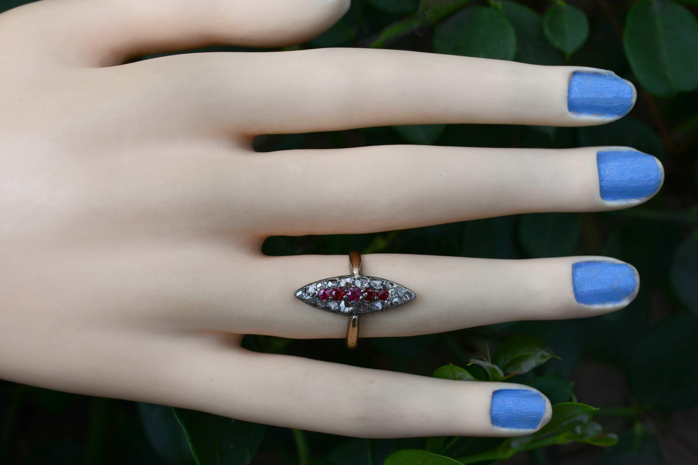 A statement ring that has turned heads for 150 years with a stunning Ruby spine and rose cut diamond surround. We love the long, sexy navette, or marquise shape of this cocktail or dinner ring as it was called in Victorian times. The crown made of