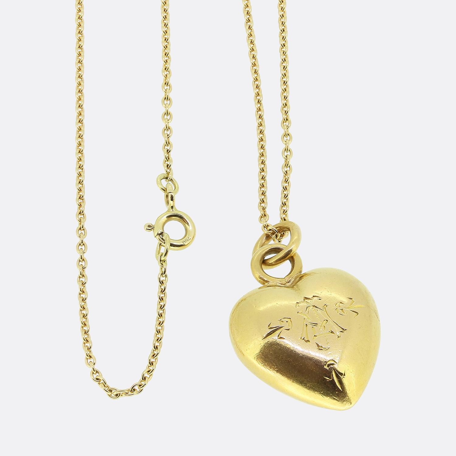 Here we have a beautiful ruby set pendant necklace. This antique pendant has been crafted from 18ct yellow gold into the the shape of a solid love heart and expertly set with a round faceted ruby possessing a rich vivid red colour