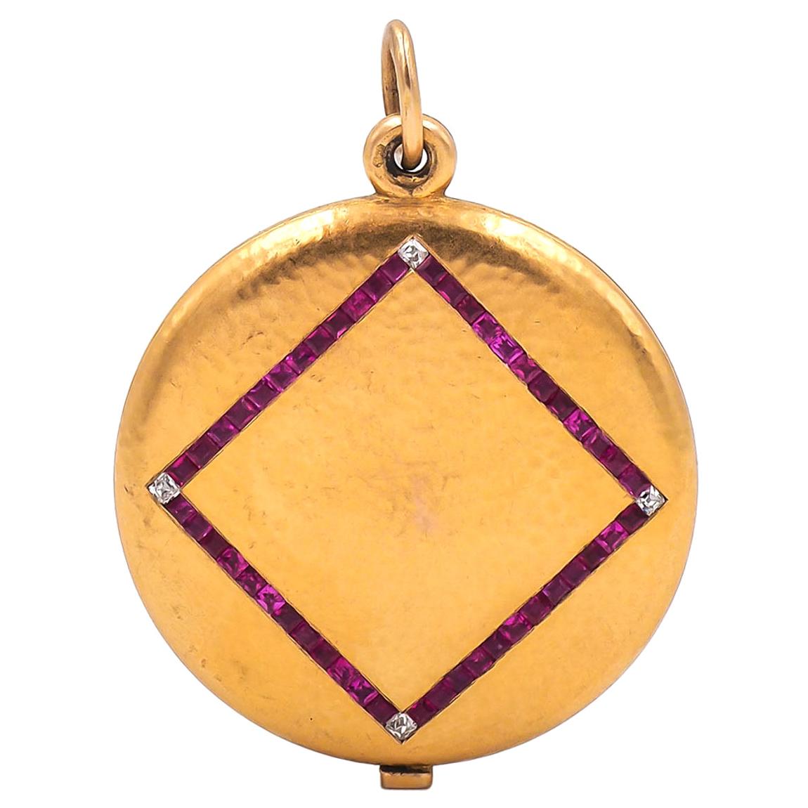 Victorian era Ruby & Diamond Slider Locket composed of 14k yellow gold. With 48 square calibré cut rubies (non heat treated) weighing approximately 1.44 carats in total, and 4 Old Mine cut diamonds weighing approximately 0.16 carats in total. With a