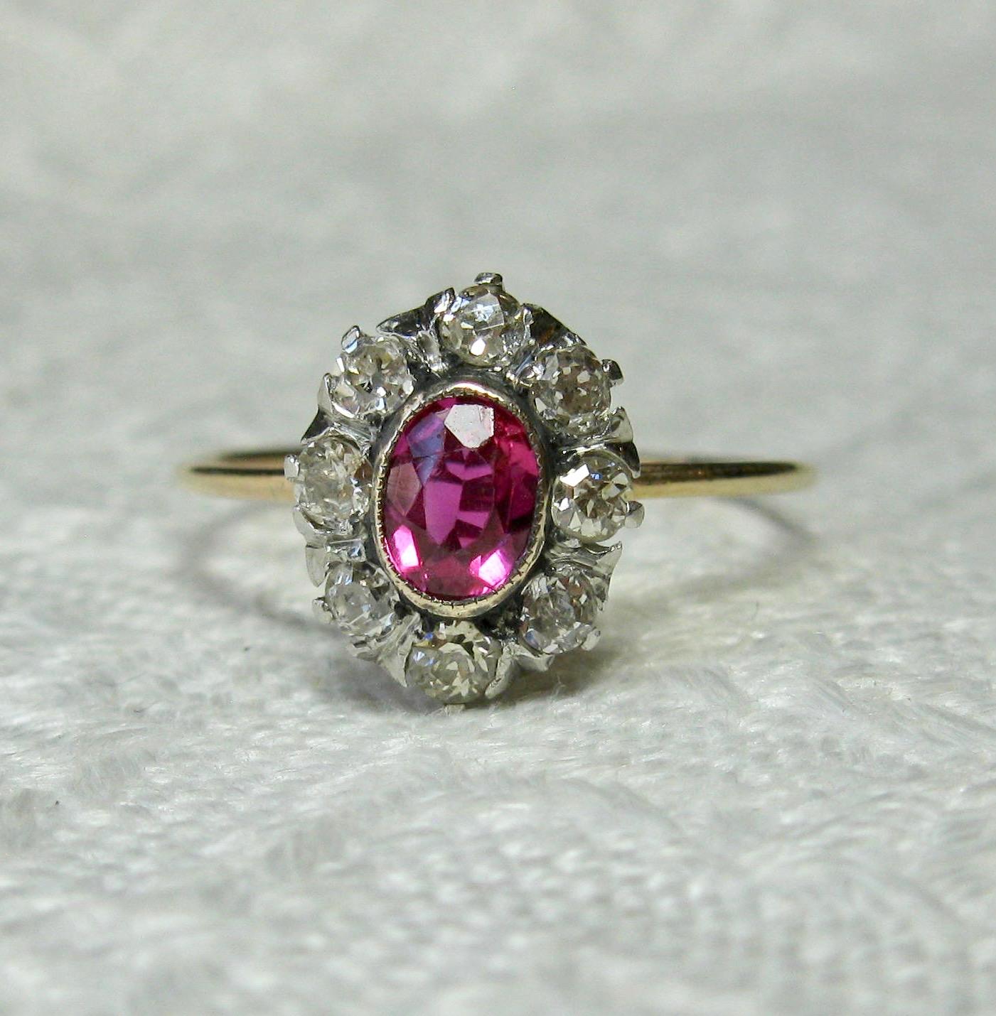 An Antique Victorian - Edwardian Ring with a gorgeous natural fine Red Ruby of incredible color and stunning beauty. The ruby is surrounded by a halo of 8 sparkling antique Old Mine Cut Diamonds. This is the combination everyone dreams of!  The