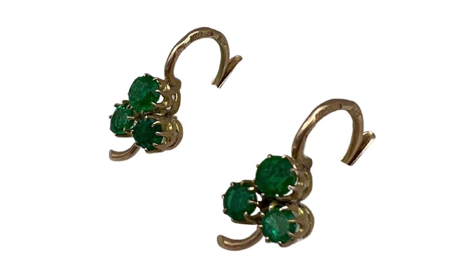 Product details:

The earrings are made out of 14K yellow gold and 3 emeralds shaped as clover motif. The earrings feature lever back closure. Marked 56 for Russian gold.

Measurements: 1/2” x 9/16”.
Weight: 2.4 grams. 