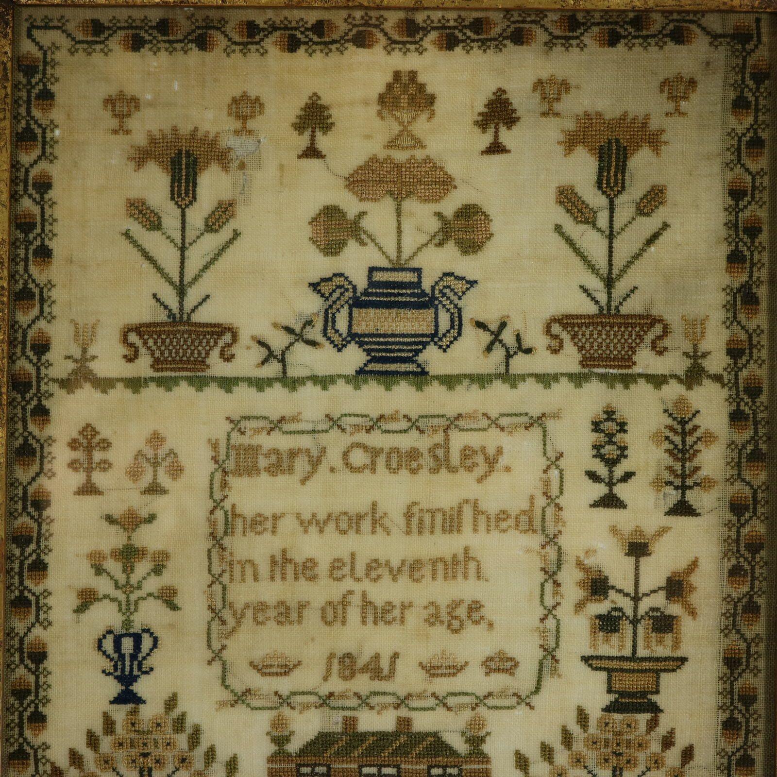 Victorian Sampler, 1841, by Mary Croesley. The sampler is worked in silk threads on a linen ground, mainly in cross stitch. Meandering strawberry border. Colours green, light brown, dark brown, silver, blue. Signed and dated, 'Mary Croesley. Her