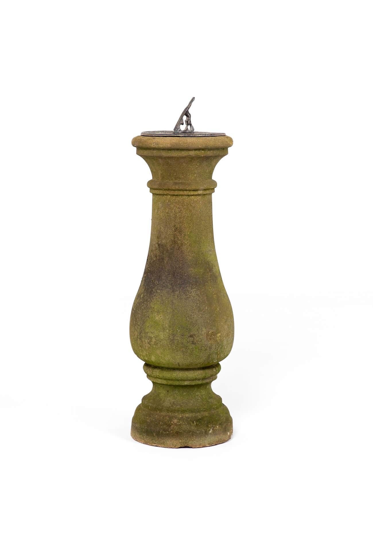A superb weathered Victorian sandstone sundial of baluster form with a molded circular base.

The top has a circular lead dial with Roman numerals and sun detailing to the face and a classical figure to the hand.

English, circa 1880.

H: 74 CM  H: