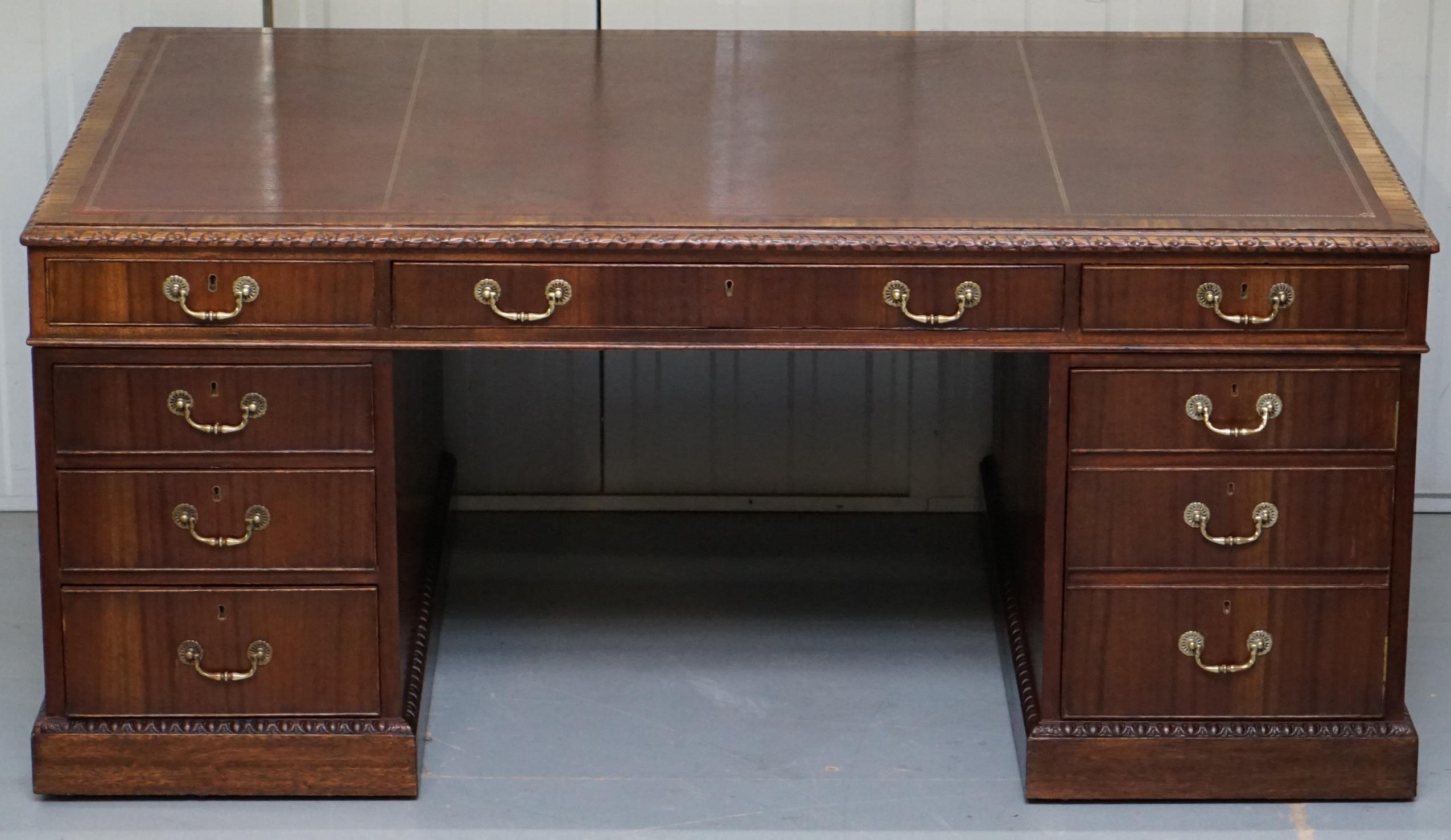We delighted to offer for sale this large Victorian twin pedestal 12 drawer and 2 cupboard Sapele wood double sided partner desk with reddish brown leather top and oversized castors 

This desk is a good large size, originally designed as you can