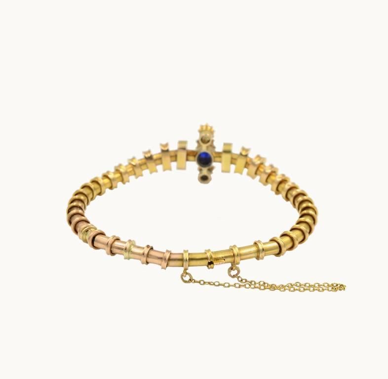 Antique Victorian 14 karat yellow gold bracelet from circa 1900.  This beautiful bracelet features an oval cut sapphire, approximately 0.85 carats, flanked by two 0.50 carat diamonds with an additional 12 rose cut diamonds.  

Bracelet measures