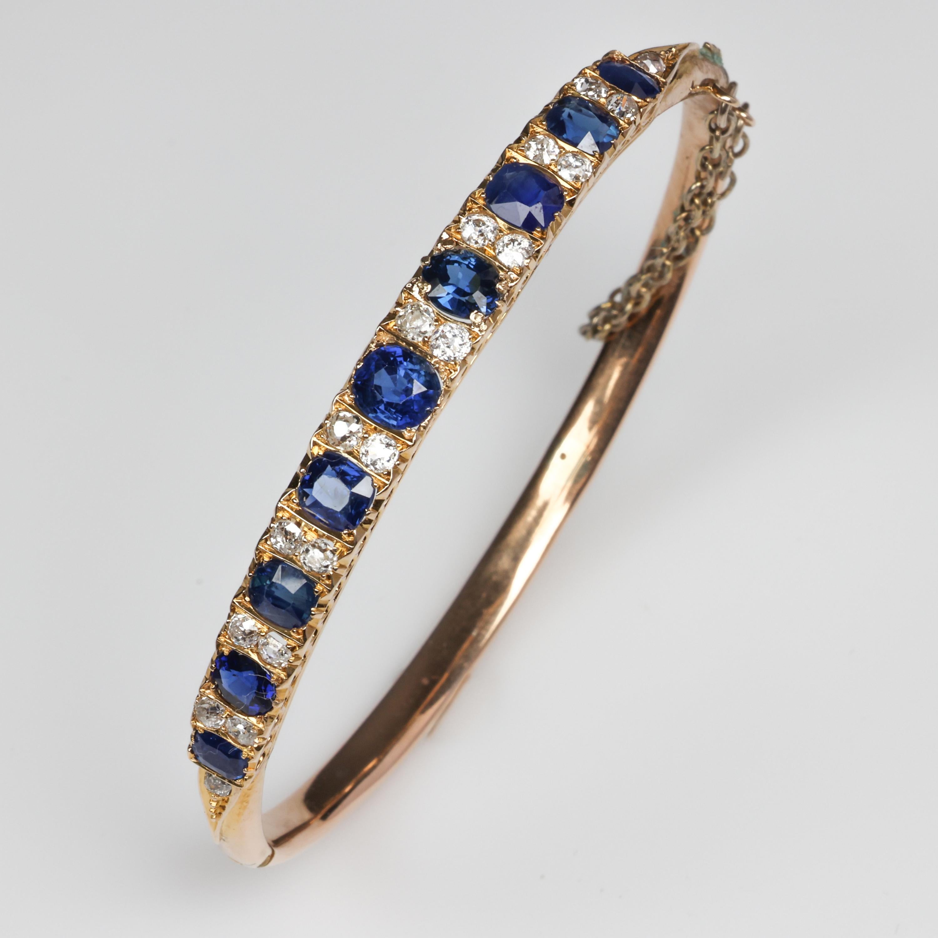 Approximately 2.78 carats of royal blue natural and untreated oval-cut Palin sapphires and about half-a-carat of bright white Ole-European cut diamonds scintillate and utterly delight from within the frame of rosy 14K gold. The interior of the