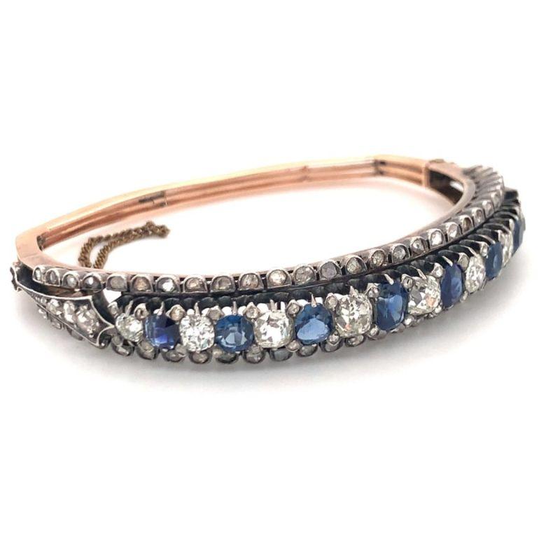 Sapphire and old mine / old euro cut diamond cuff in silver-topped gold featuring 3.75 ct. in sapphires and 5 ct. in diamonds with K-L-M color and SI-1 clarity. Original Victorian piece with English hallmarks. 

Superb, eye-catching,