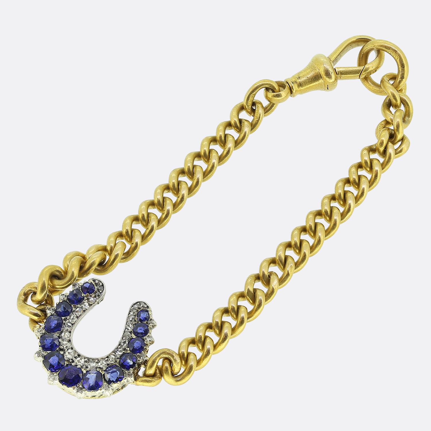 Here we have a wonderful Victorian horseshoe bracelet. The horseshoe is set with 13 beautiful blue sapphires and 34 rose cut diamonds. The chain is a soft 18ct yellow gold antique curb link. It is finished with an easy to use swivel clasp.

Please