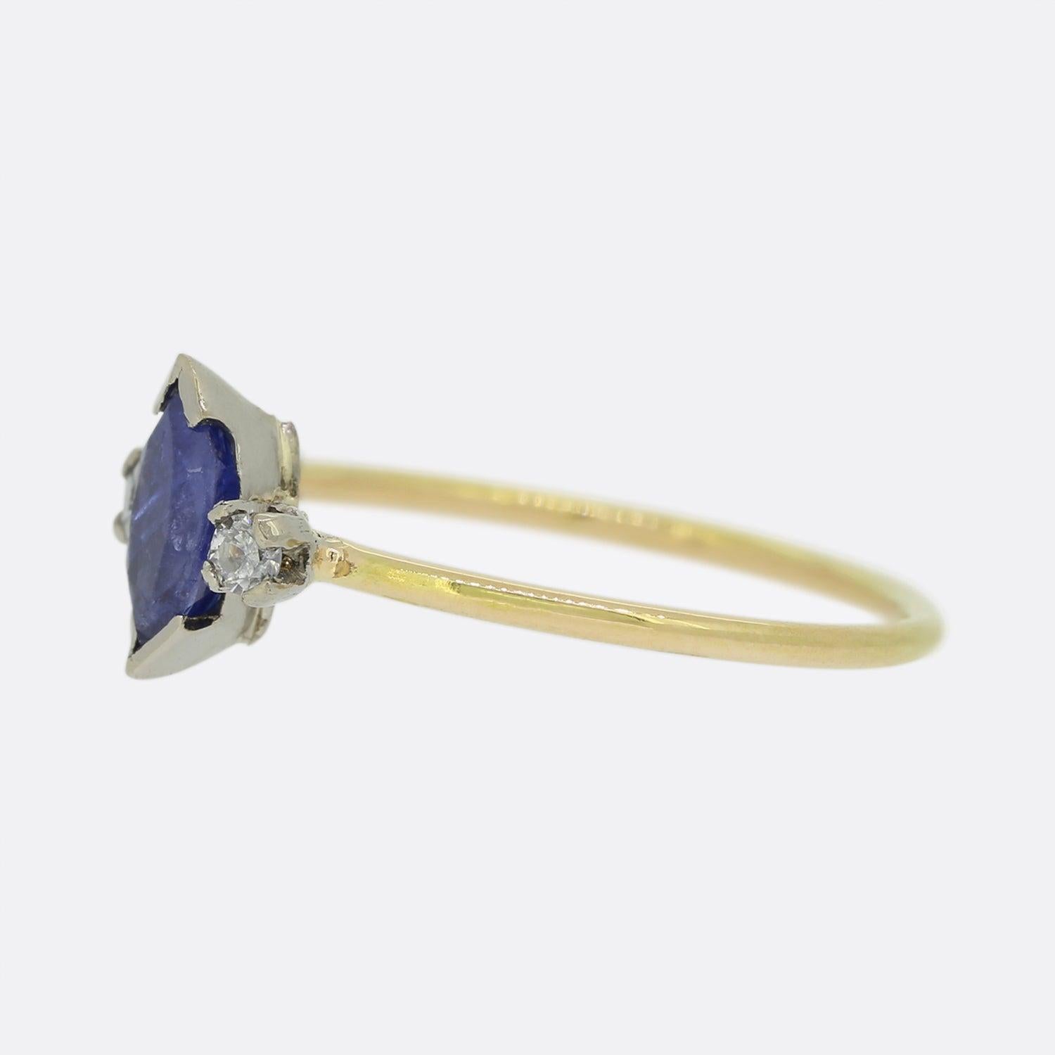 Here we have a lovely sapphire and diamond three stone ring. The focal marquise shaped sapphire sits bezel set at the centre of the piece and is flanked on either side by a single round shaped diamond; one white and one blue.

This piece started