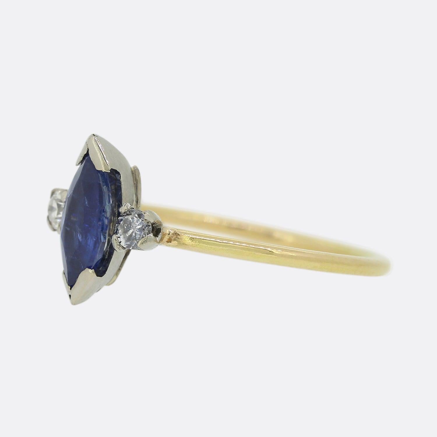 Here we have a lovely sapphire and diamond three stone ring. The focal marquise shaped sapphire sits bezel set at the centre of the piece and is flanked on either side by a single round shaped diamond; one white and one blue.
This piece started life