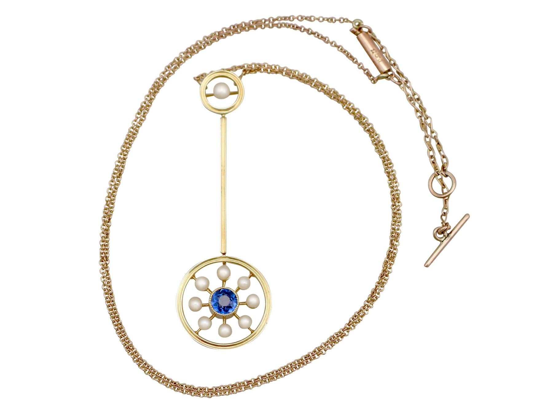 An impressive antique Victorian 0.35 carat sapphire and seed pearl, 15 and 9k yellow gold necklace; part of our diverse antique jewelry and estate jewelry collections.

This fine and impressive antique sapphire necklace has been crafted in 15k