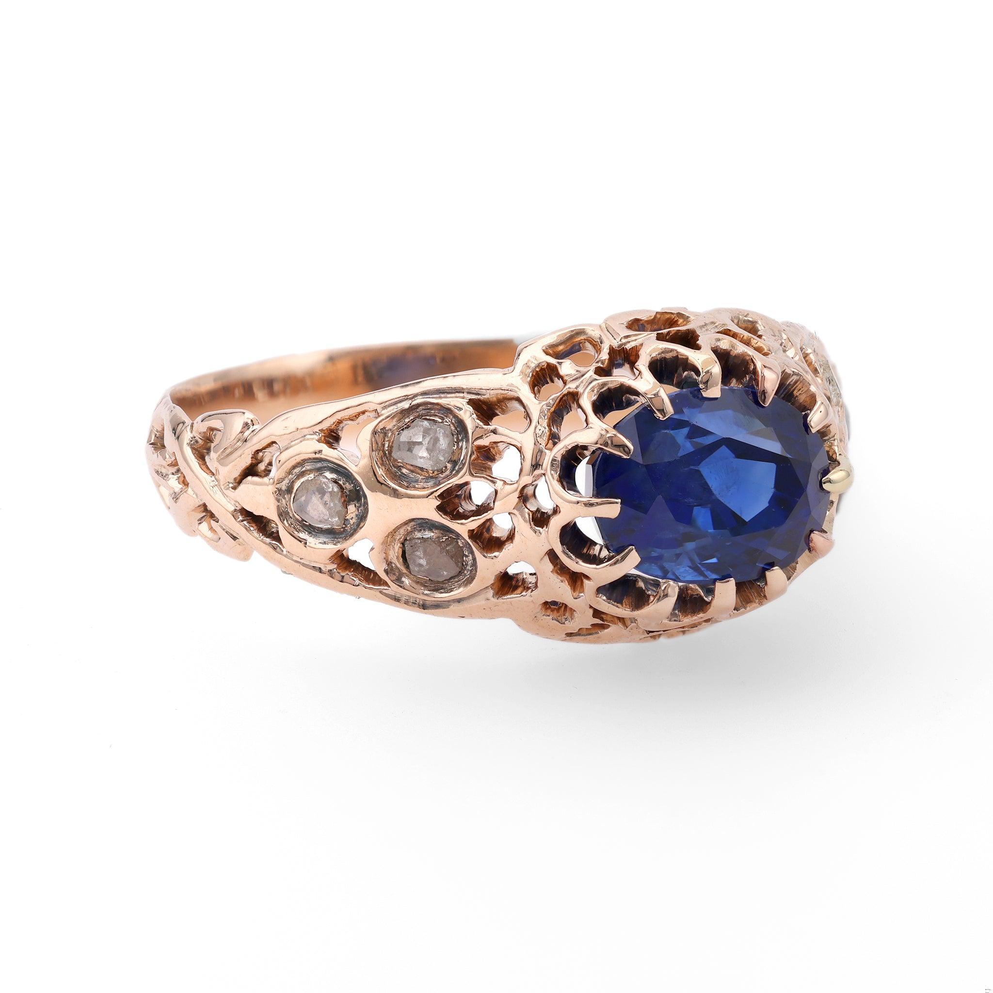 One Victorian Sapphire Diamond 10k Rose Gold Ring. Featuring one oval mixed cut sapphire weighing 1.72 carats. Accented by six senaille cut diamonds with a total weight of approximately 0.05 carat, graded I-J color, I clarity. Crafted in 10 karat