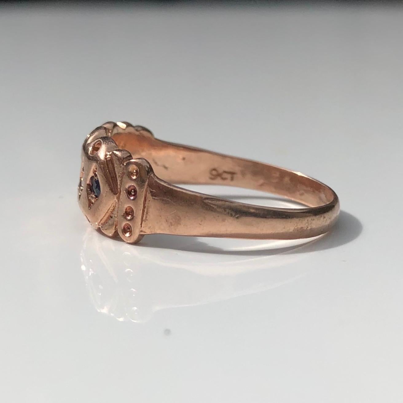 The gorgeous design of this ring includes scalloped and dot detail and is set with three sapphire points and two diamond points. The stones are small but have such a pretty sparkle and look gorgeous next to the rose gold. 

Ring Size: Q or 8
Band