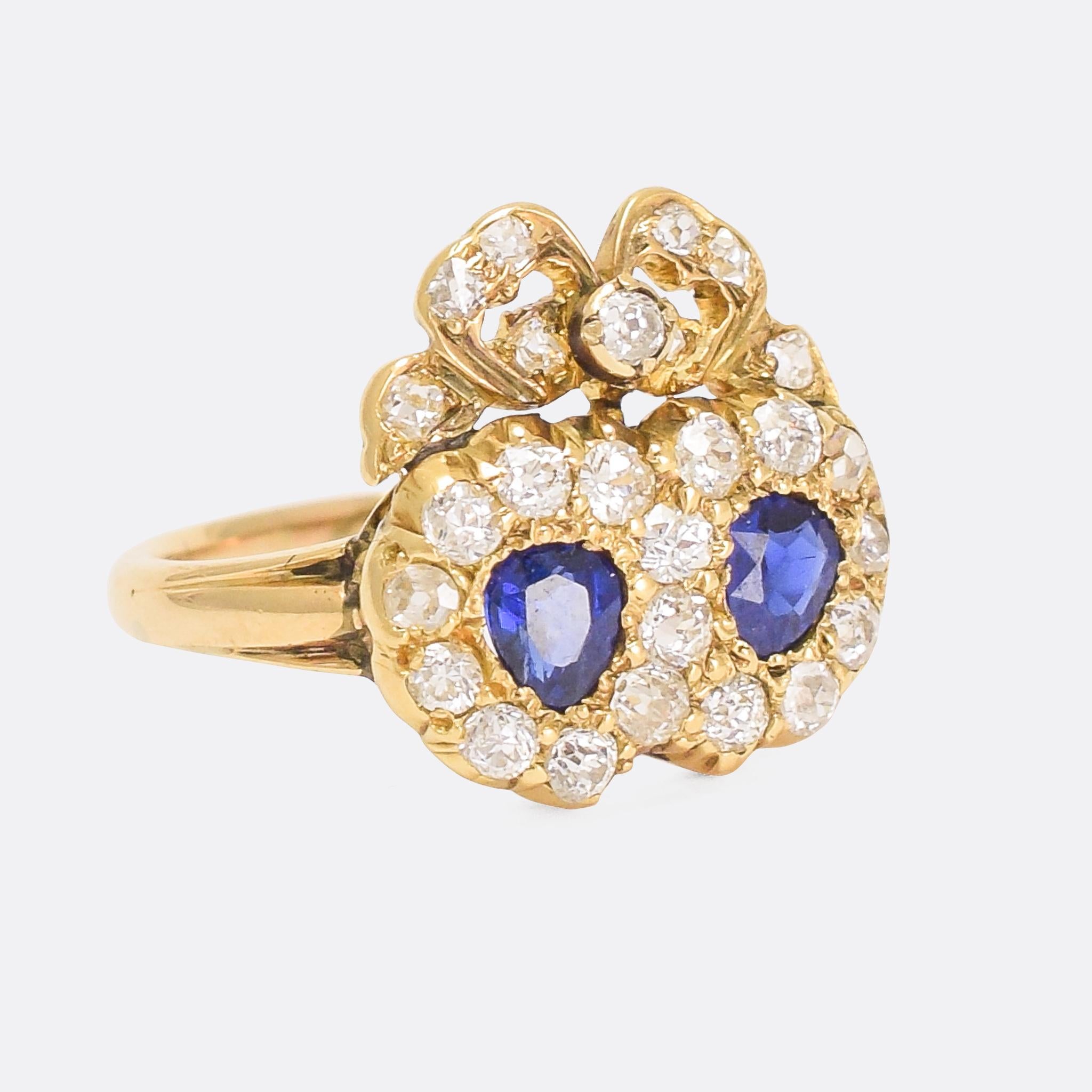 A stunning Victorian sapphire and diamond double heart ring dating from the latter half of the 19th Century. It's a particularly fine example of the style, set with vivid blue sapphires and chunky old cut diamonds, the hearts joined at the top with